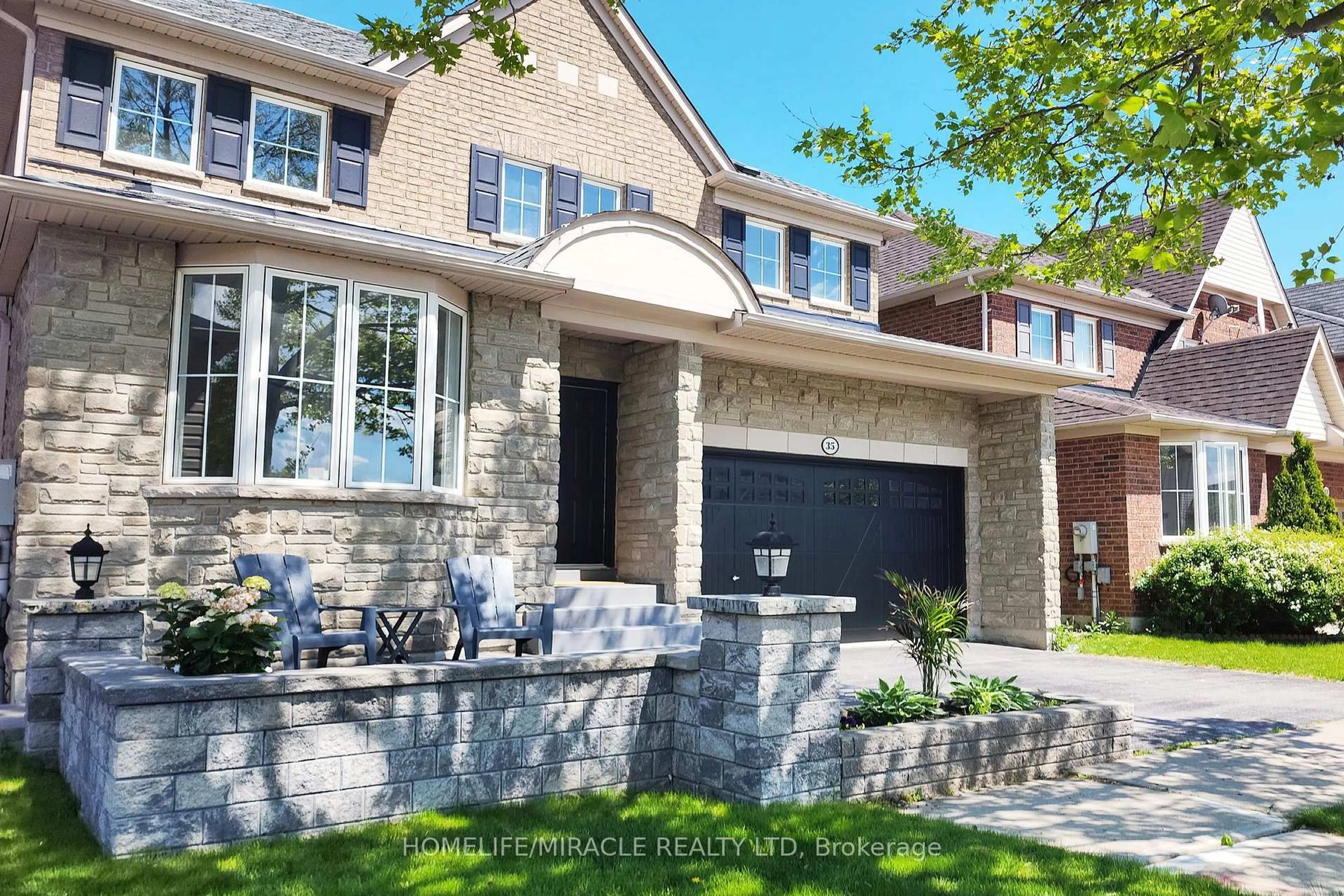 Home with brick exterior material, street for 35 Rushbrooke Way, Ajax Ontario L1Z 2C4