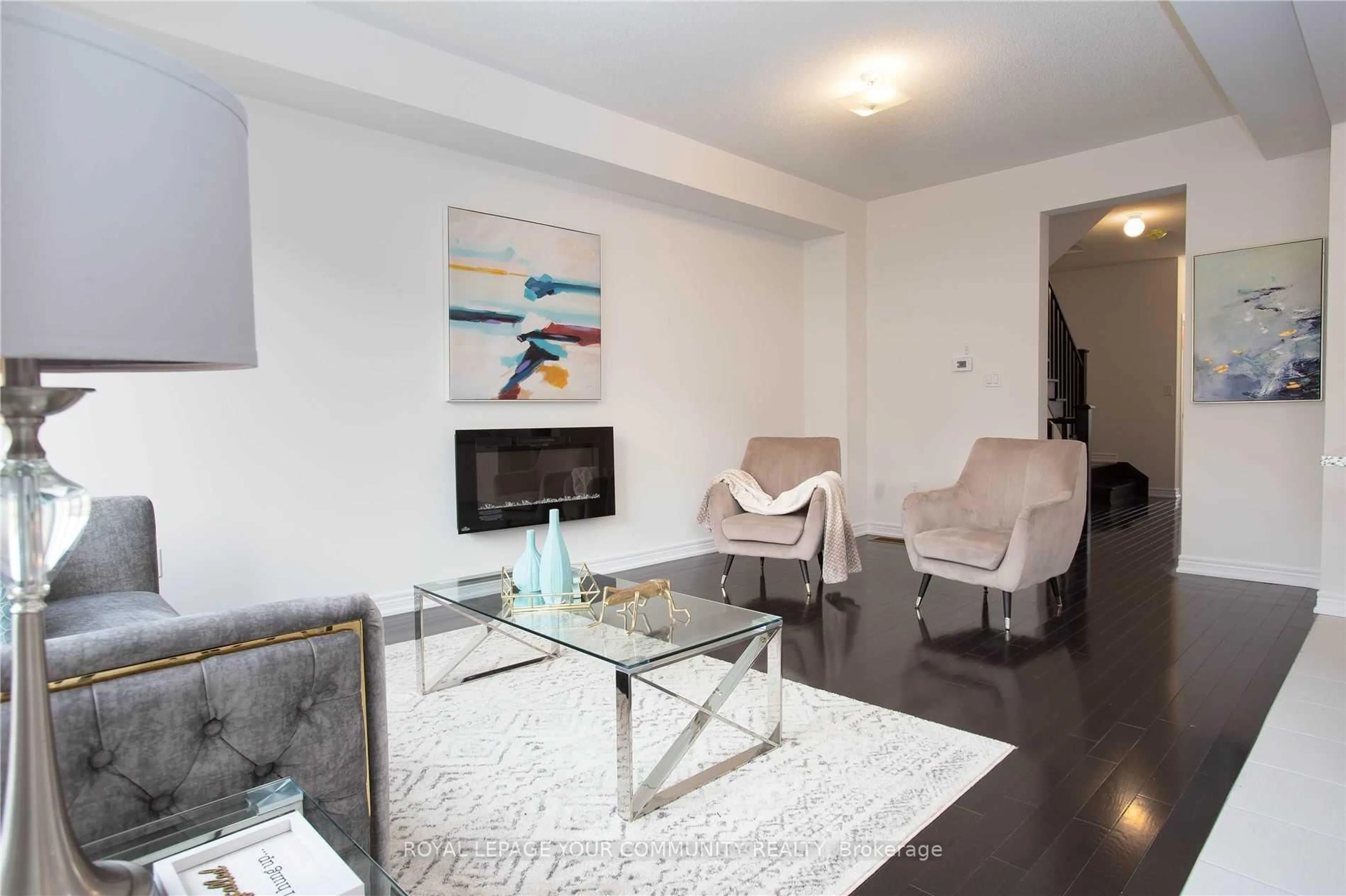 Living room with furniture, wood/laminate floor for 138 Christine Elliott Ave, Whitby Ontario L1P 0R9