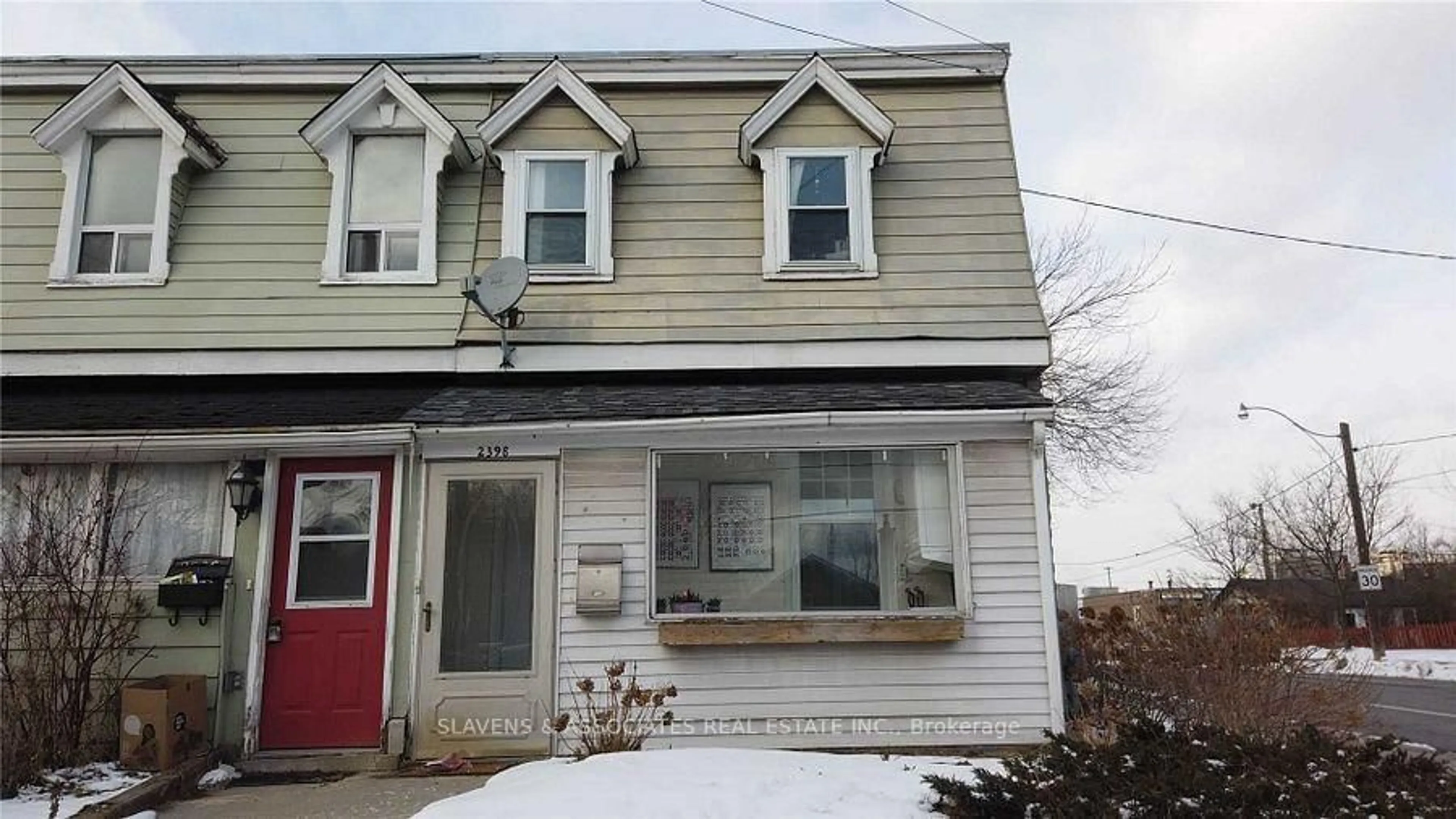Home with vinyl exterior material, street for 2398 Gerrard St, Toronto Ontario M4E 2E1