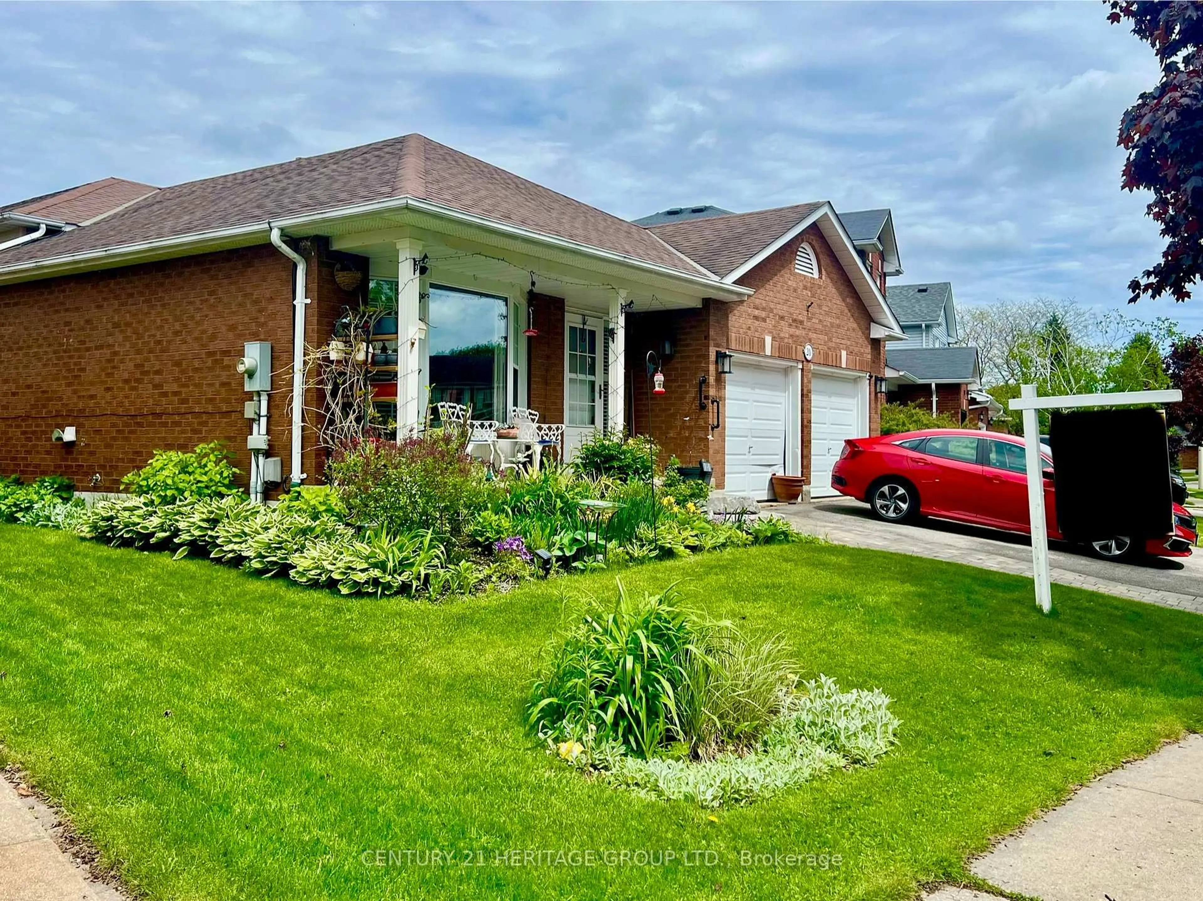 Home with brick exterior material, street for 20 Orchard Park Dr, Clarington Ontario L1C 4E2