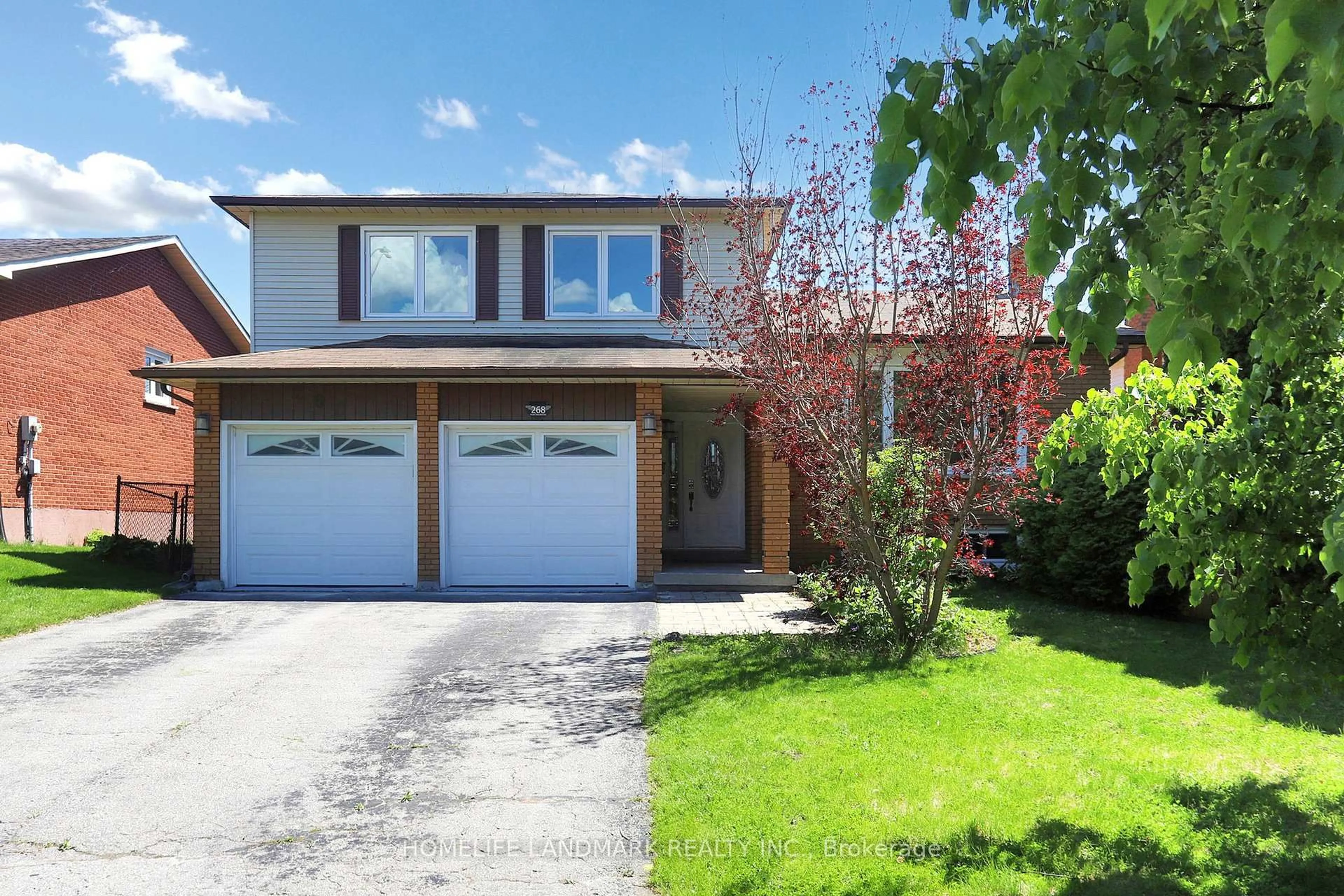 Home with brick exterior material, street for 268 Huntingwood Dr, Oshawa Ontario L1J 7C5