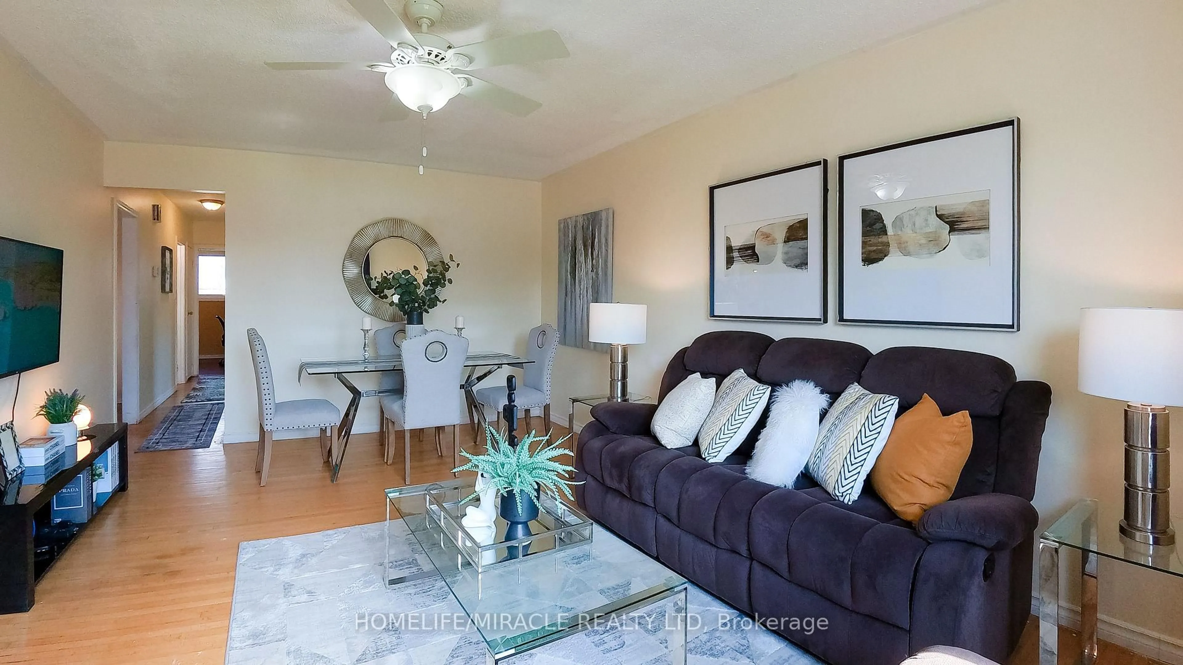 Living room with furniture, wood/laminate floor for 897 Antonio St, Pickering Ontario L1W 1T4