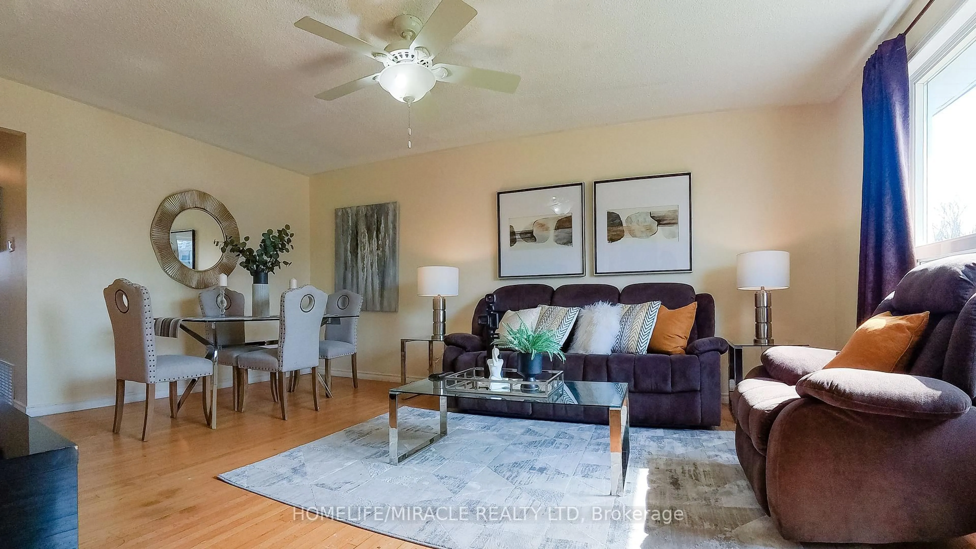 Living room with furniture, wood/laminate floor for 897 Antonio St, Pickering Ontario L1W 1T4