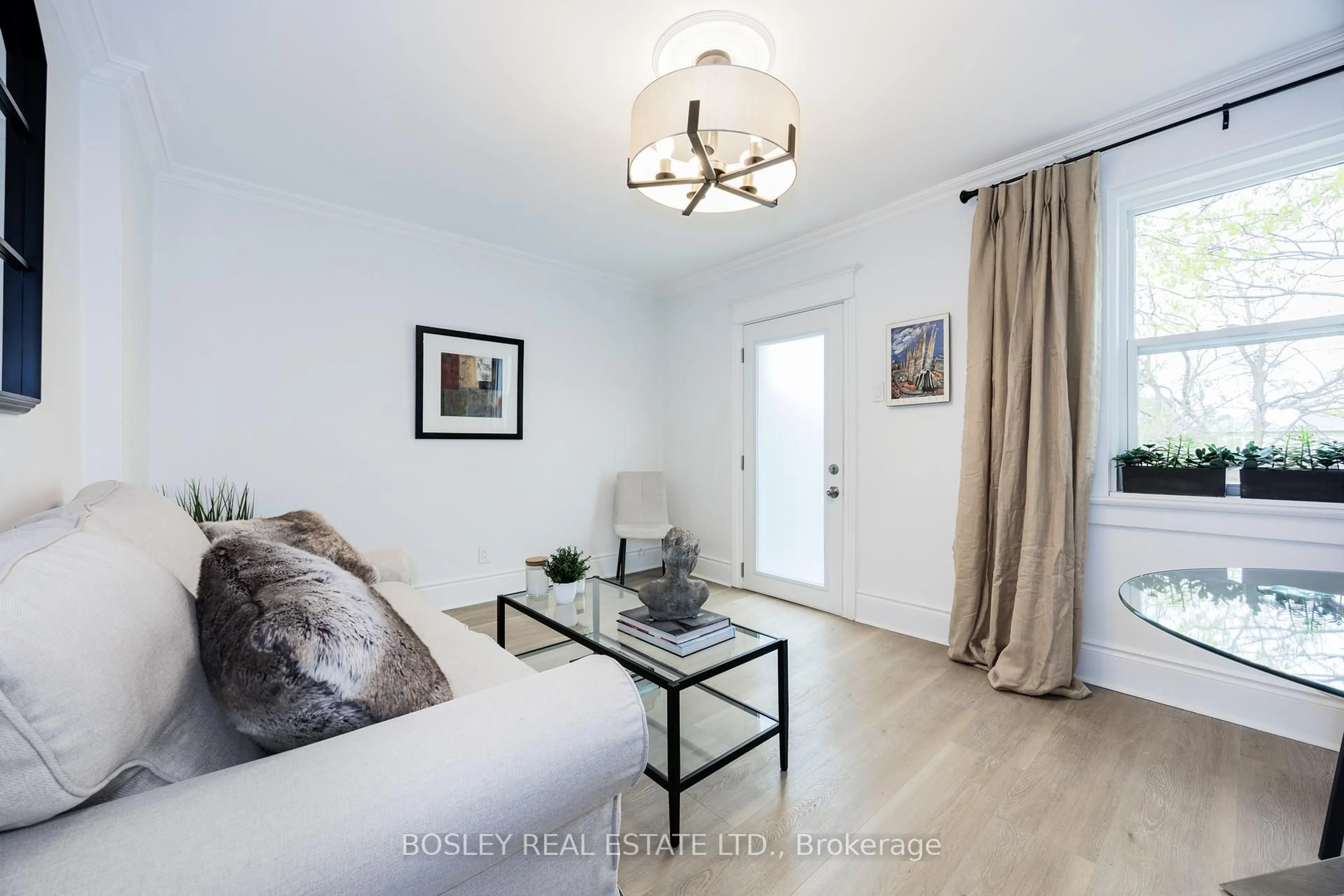 Living room with furniture, wood/laminate floor for 30 Oak Park Ave, Toronto Ontario M4C 4L7