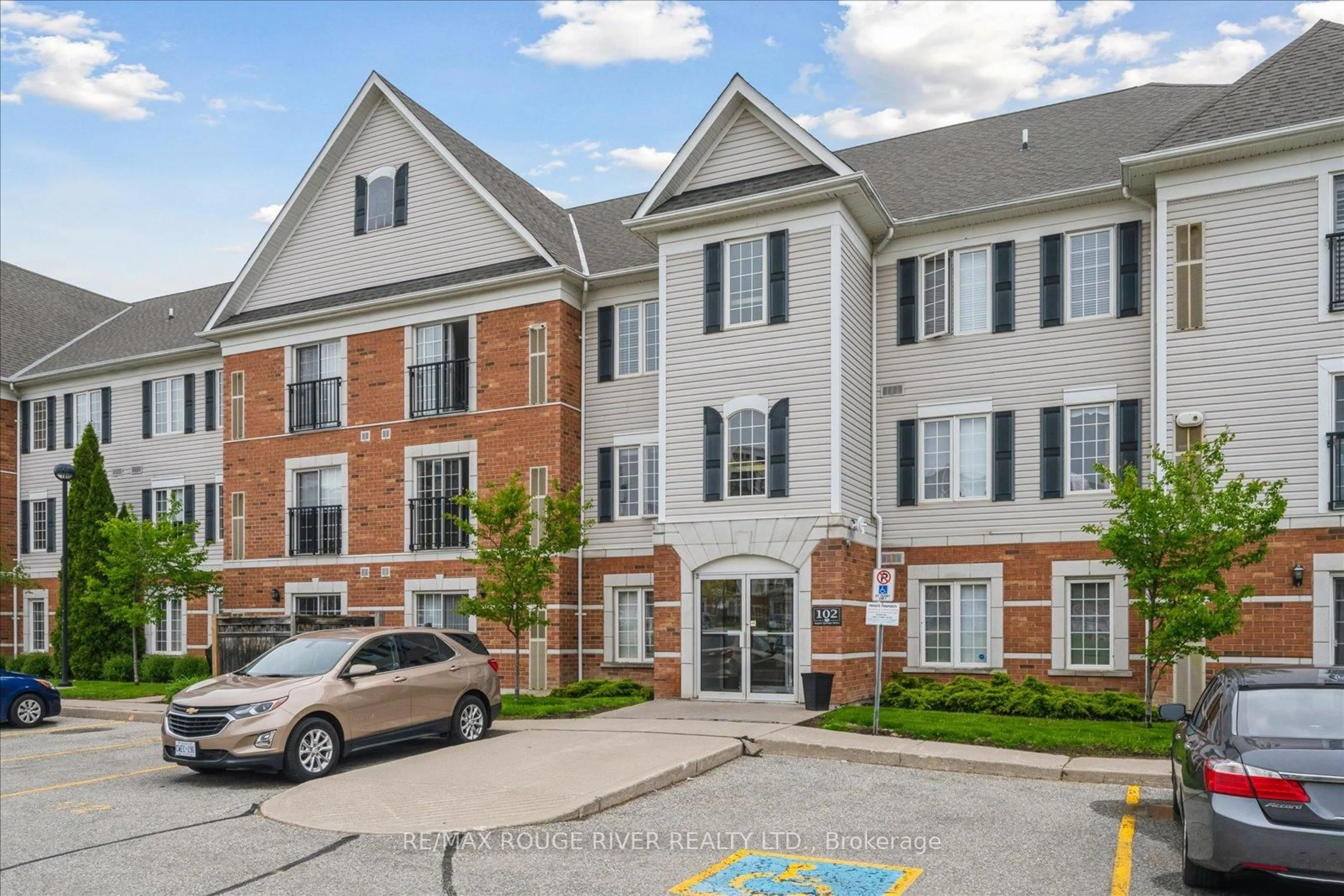 Home with brick exterior material, street for 102 Aspen Springs Dr #212, Clarington Ontario L1C 5N6