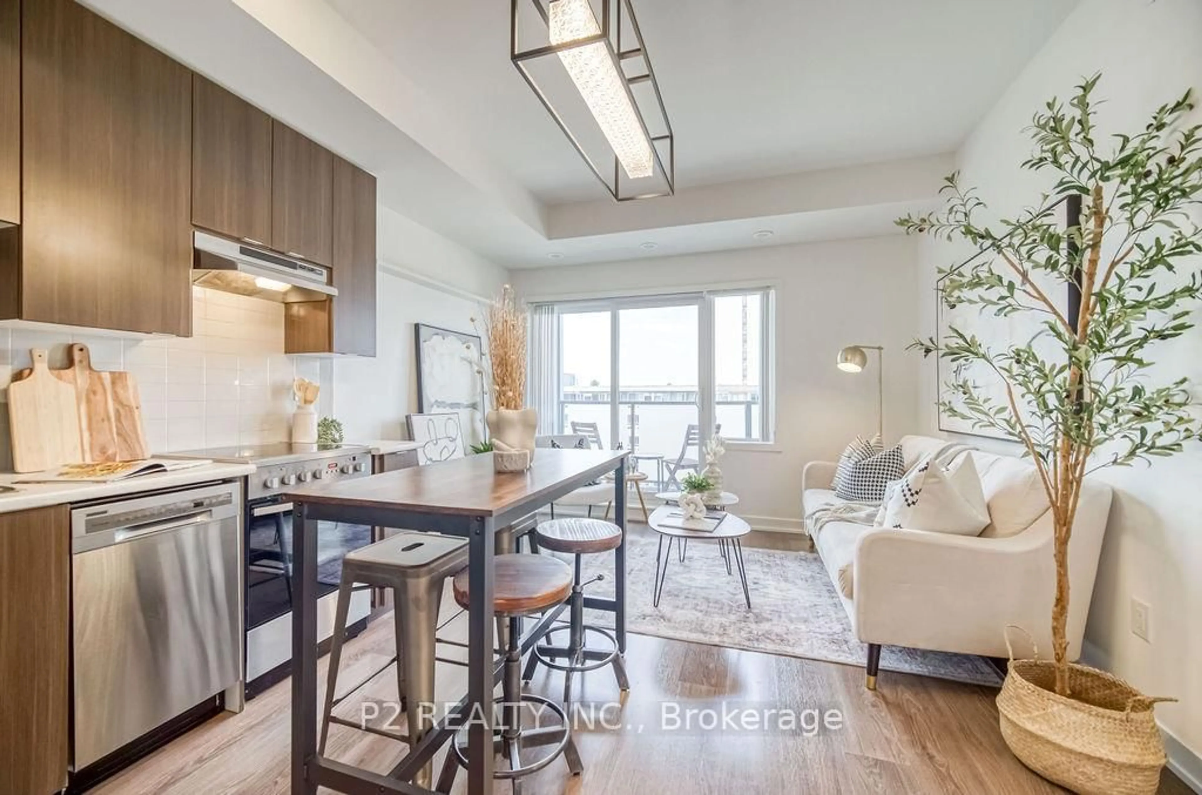 Open concept kitchen, wood/laminate floor for 5131 Sheppard Ave #503, Toronto Ontario M1B 0C9