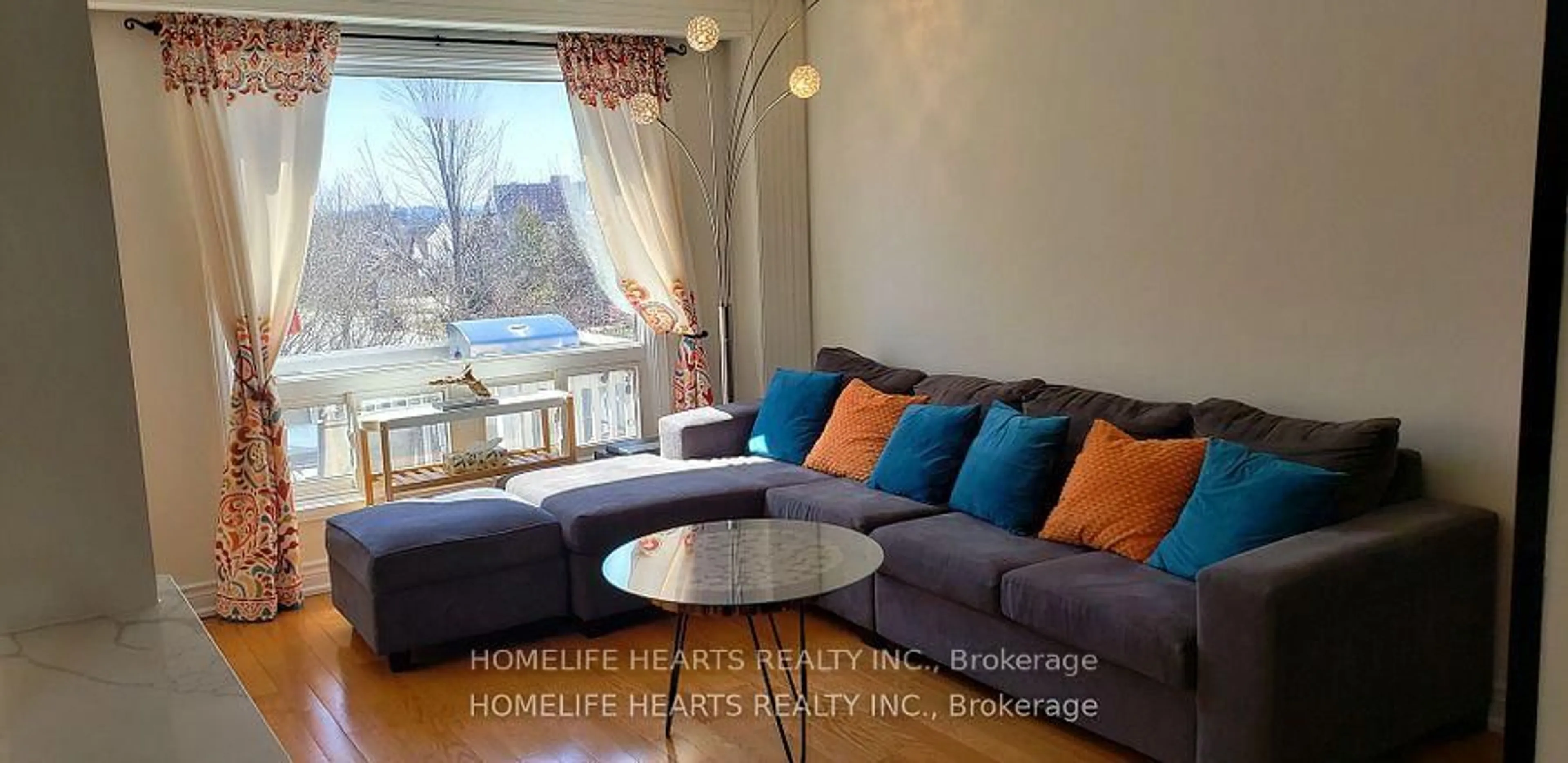Living room with furniture, wood/laminate floor for 126 Kirby Cres, Whitby Ontario L1N 6Z7
