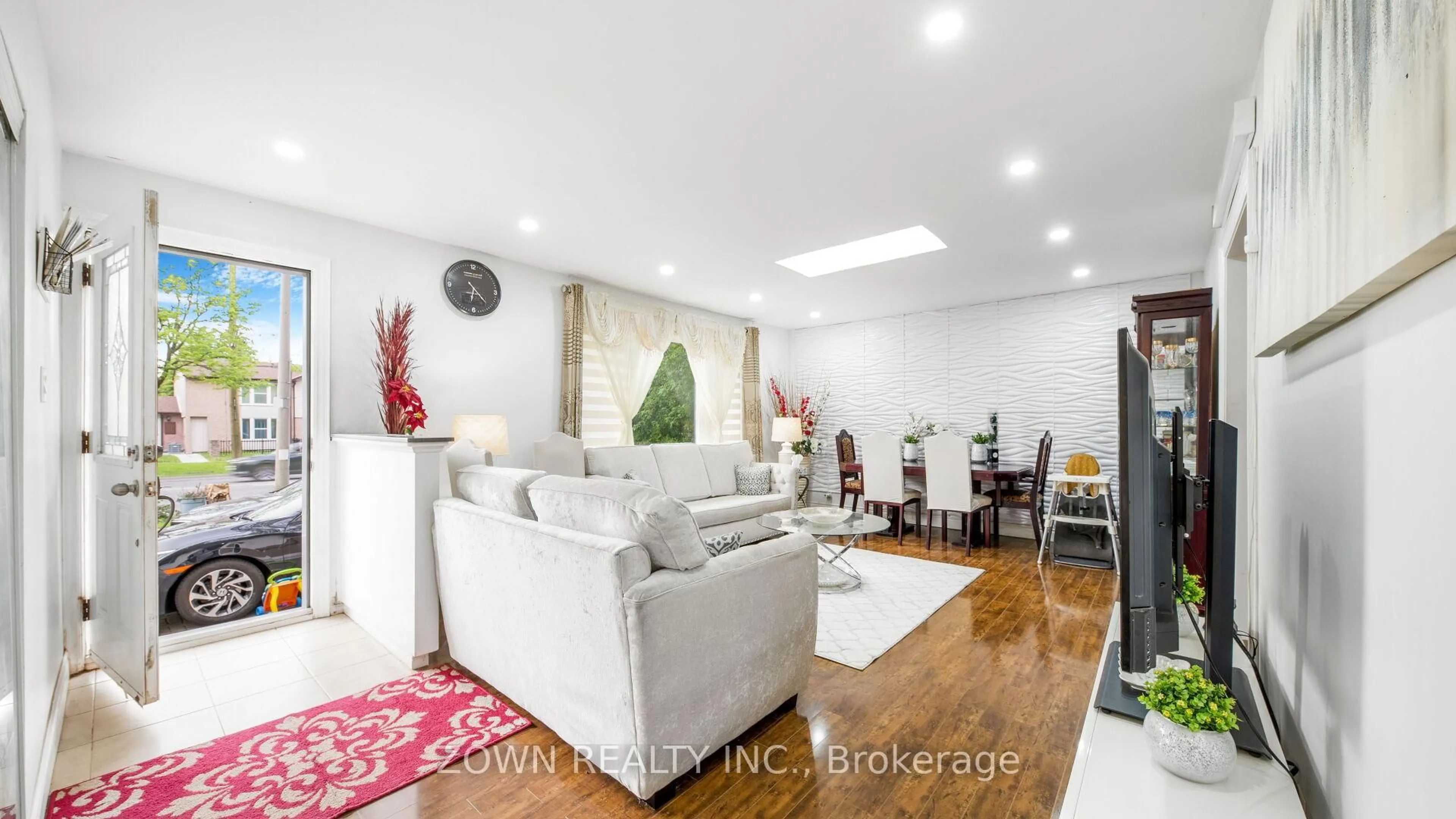 Living room with furniture, wood/laminate floor for 3853 Finch Ave, Toronto Ontario M1T 3G1