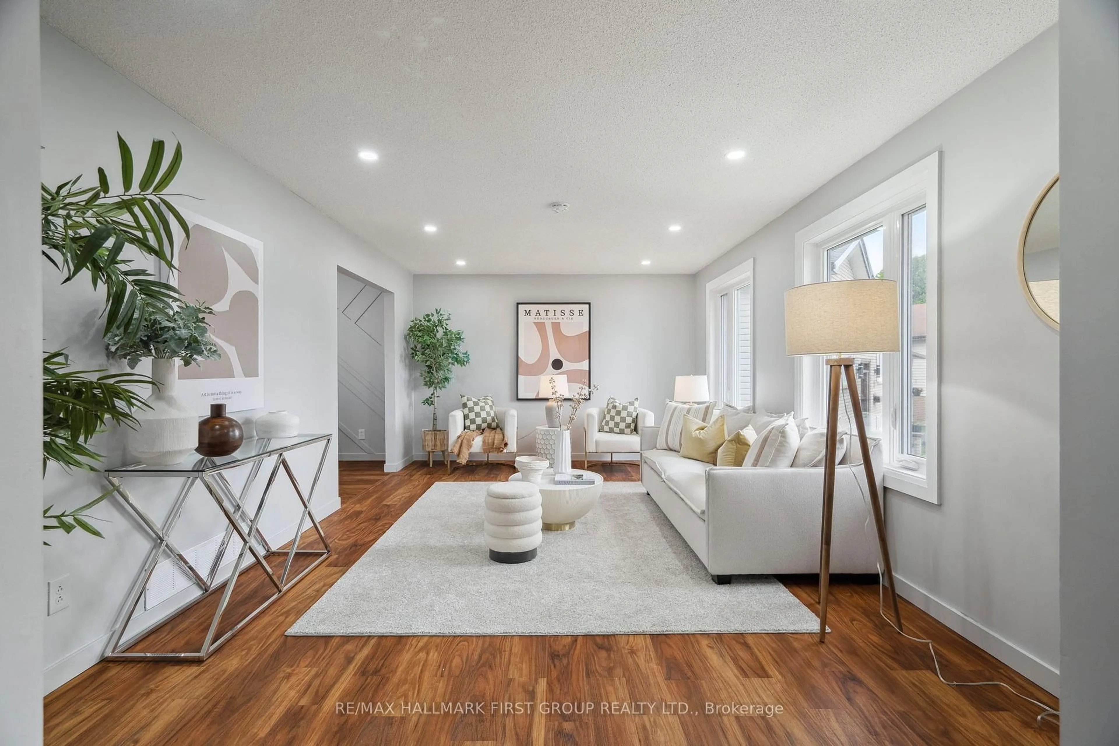 Living room with furniture, wood/laminate floor for 27 Evaleigh Crt, Whitby Ontario L1N 8N4