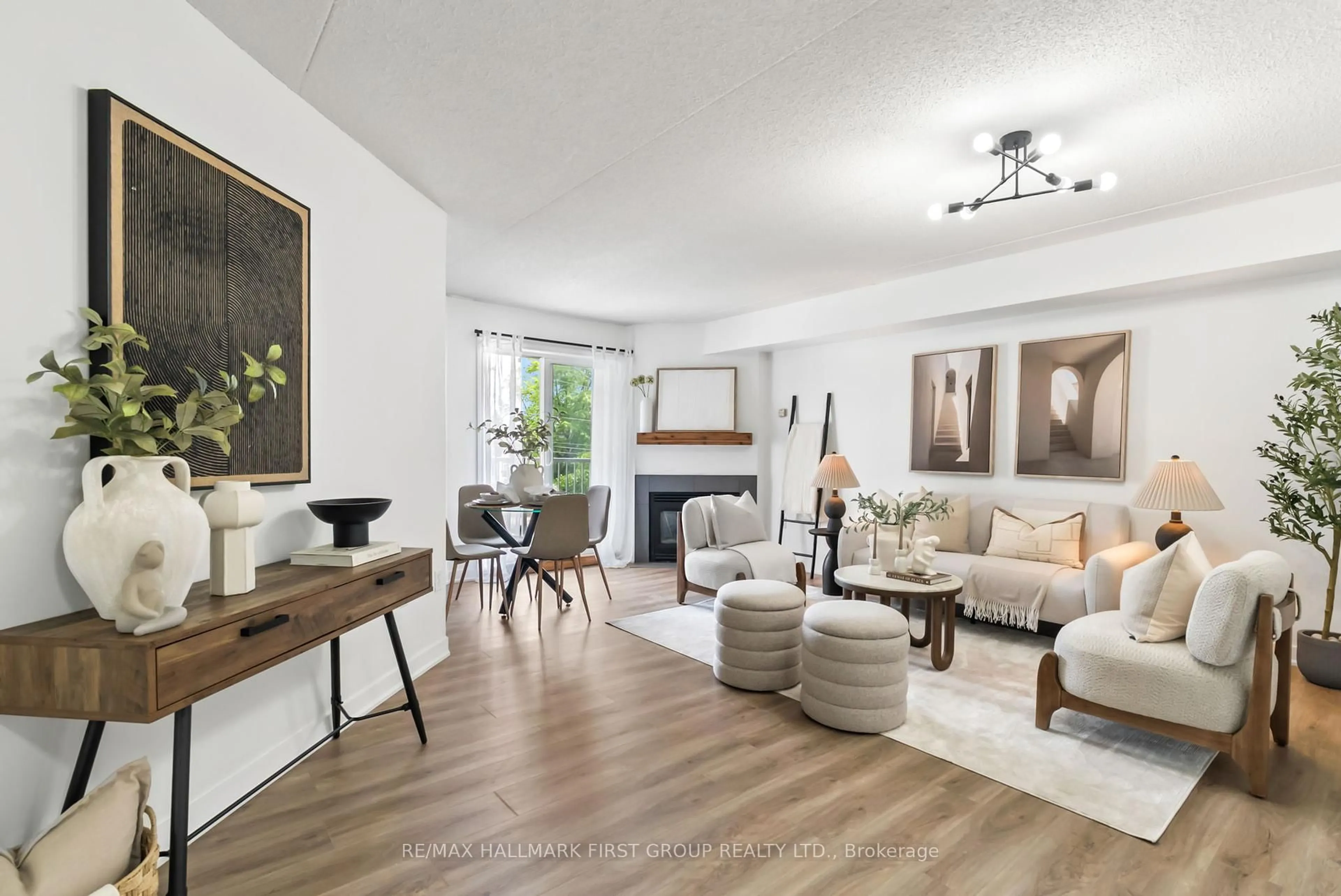 Living room with furniture, wood/laminate floor for 95 Wellington St #201, Clarington Ontario L1C 5A1