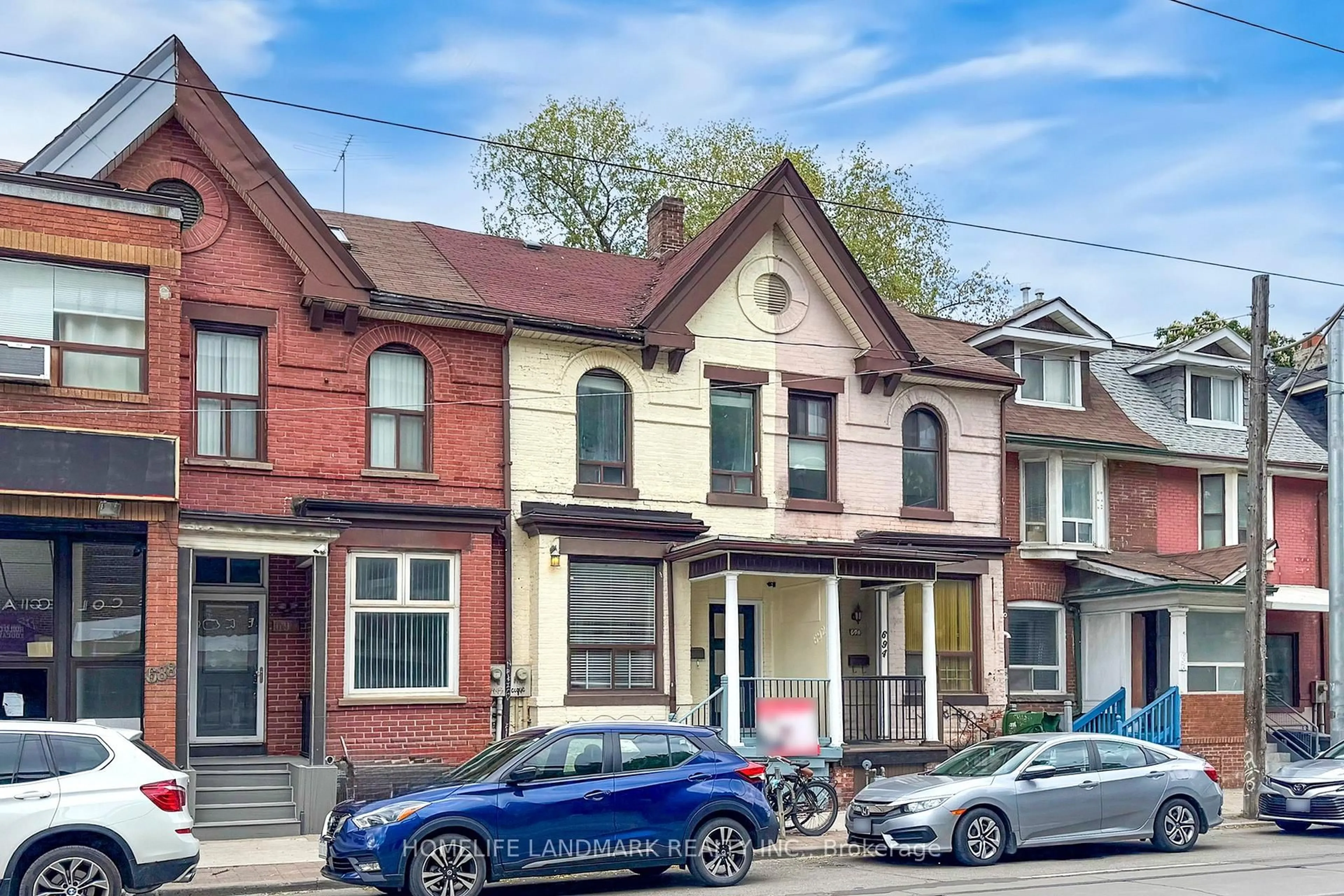Home with brick exterior material, street for 692 Gerrard St, Toronto Ontario M4M 1Y3