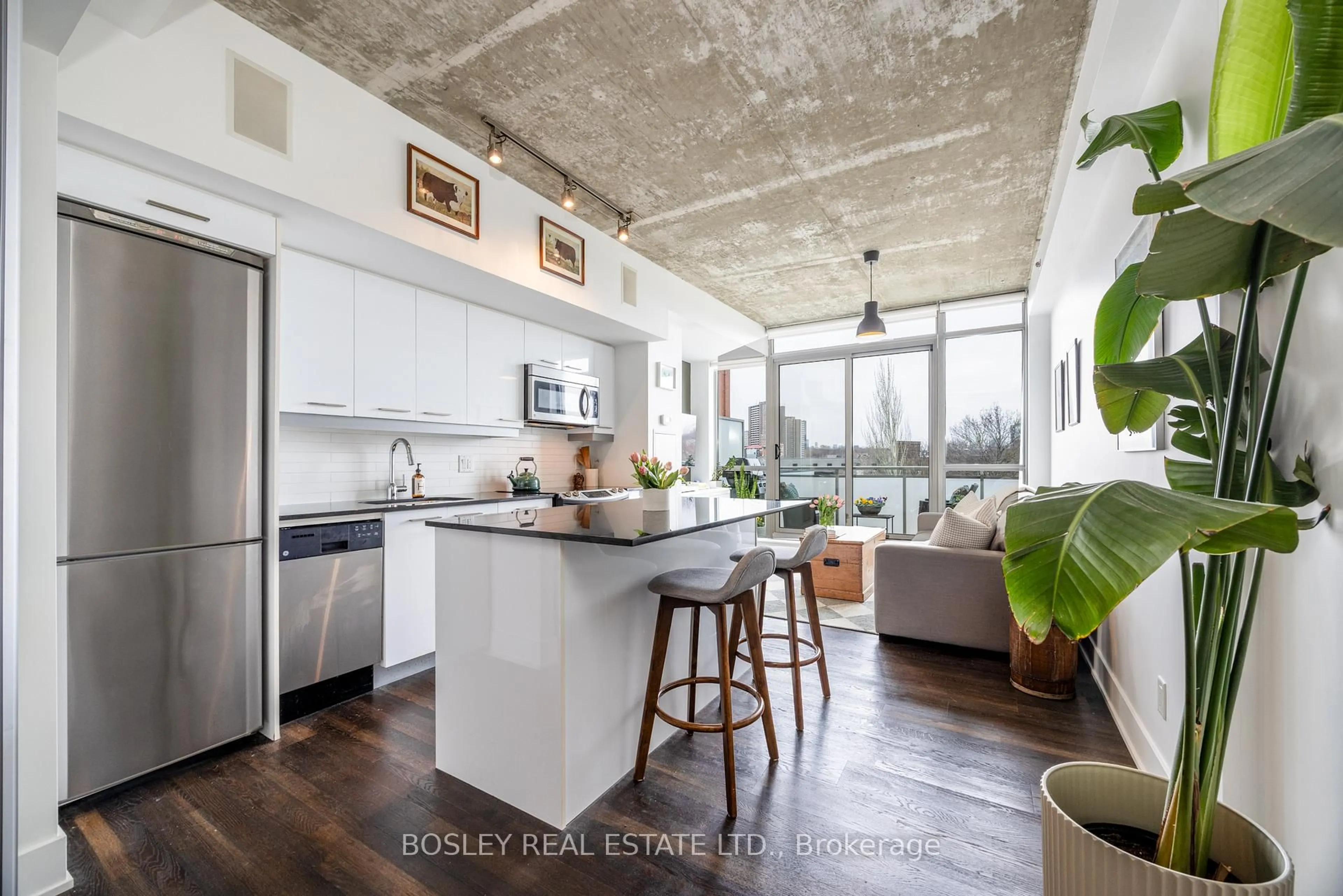 Open concept kitchen, cement floor for 630 Queen St #406, Toronto Ontario M4M 1G3