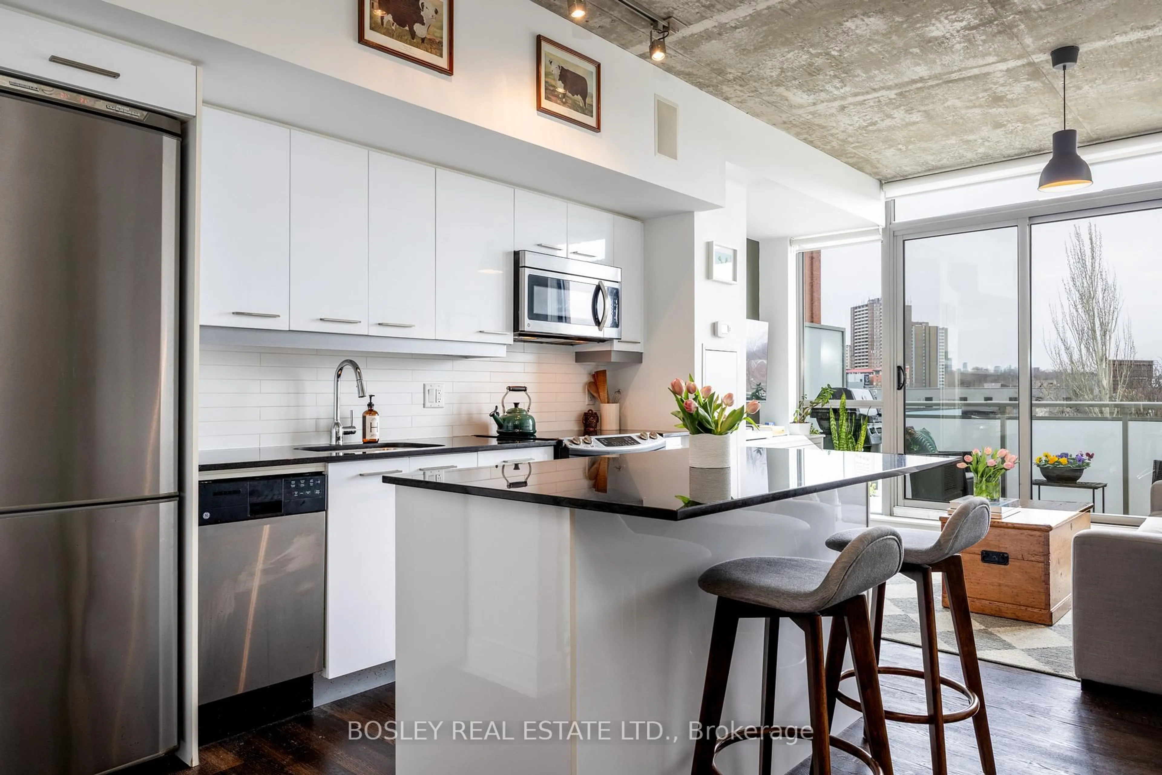 Open concept kitchen, cement floor for 630 Queen St #406, Toronto Ontario M4M 1G3