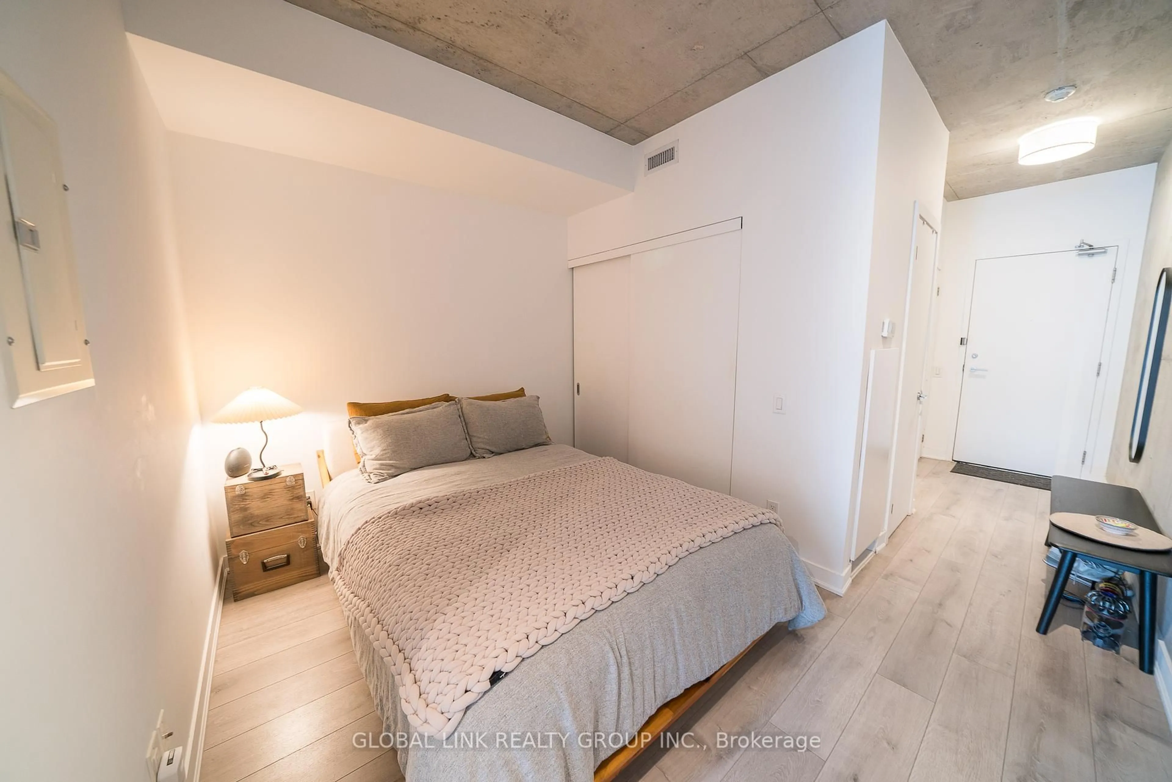 Bedroom with bed, cement floor for 319 Carlaw Ave #306, Toronto Ontario M4M 0A4
