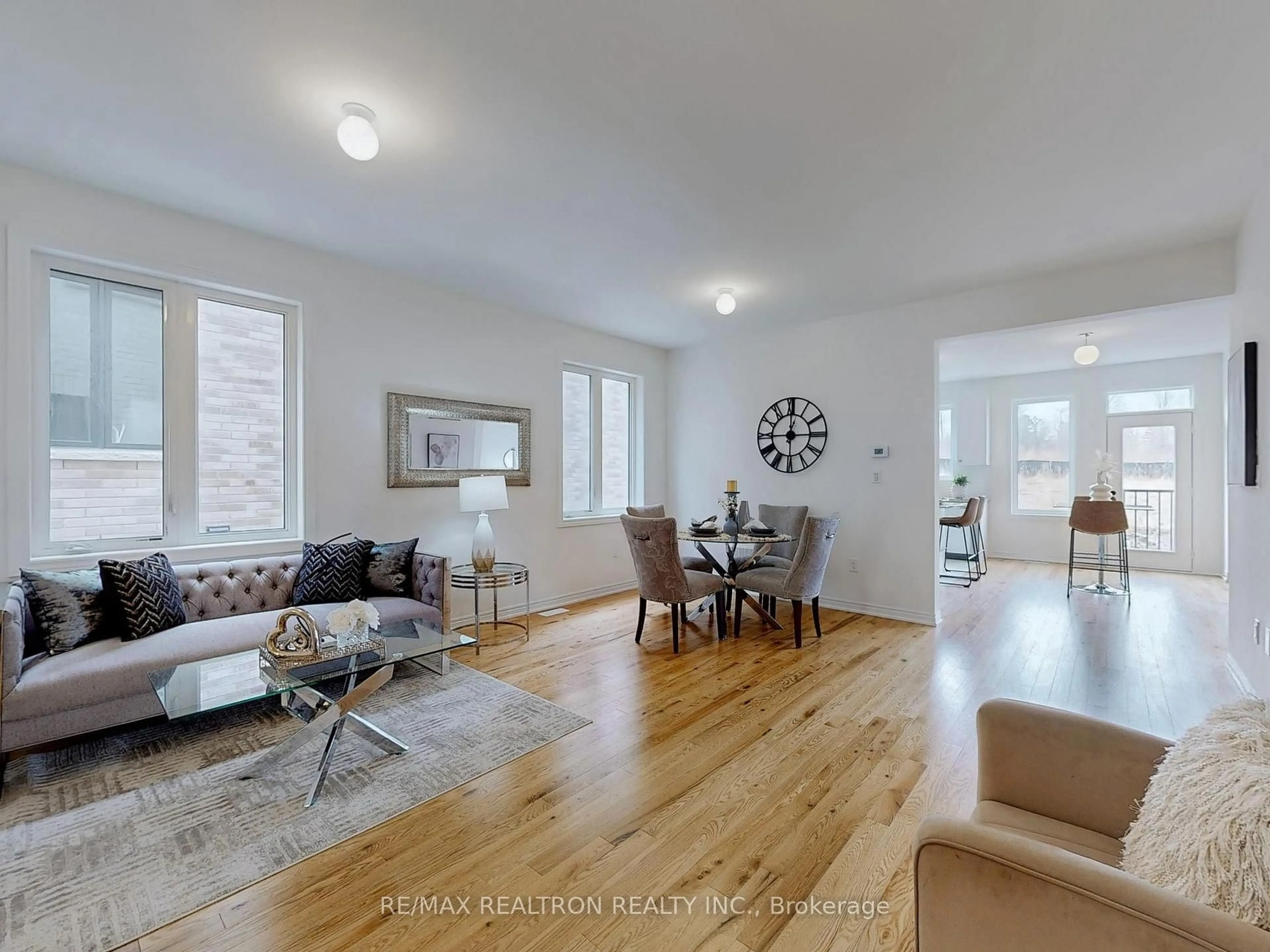 Living room with furniture, wood/laminate floor for 1260 Talisman Manr, Pickering Ontario L1X 0R8