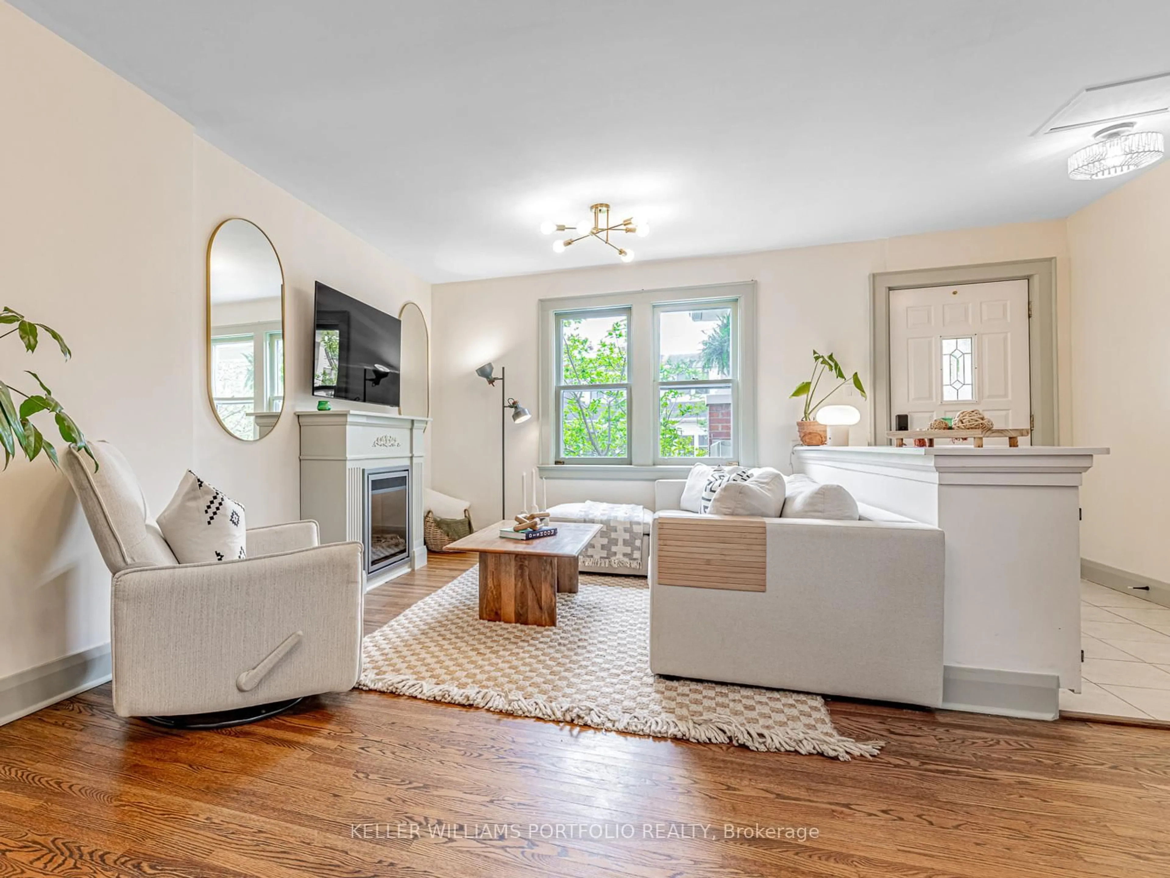 Living room with furniture, wood/laminate floor for 178 Swanwick Ave, Toronto Ontario M4E 2A6
