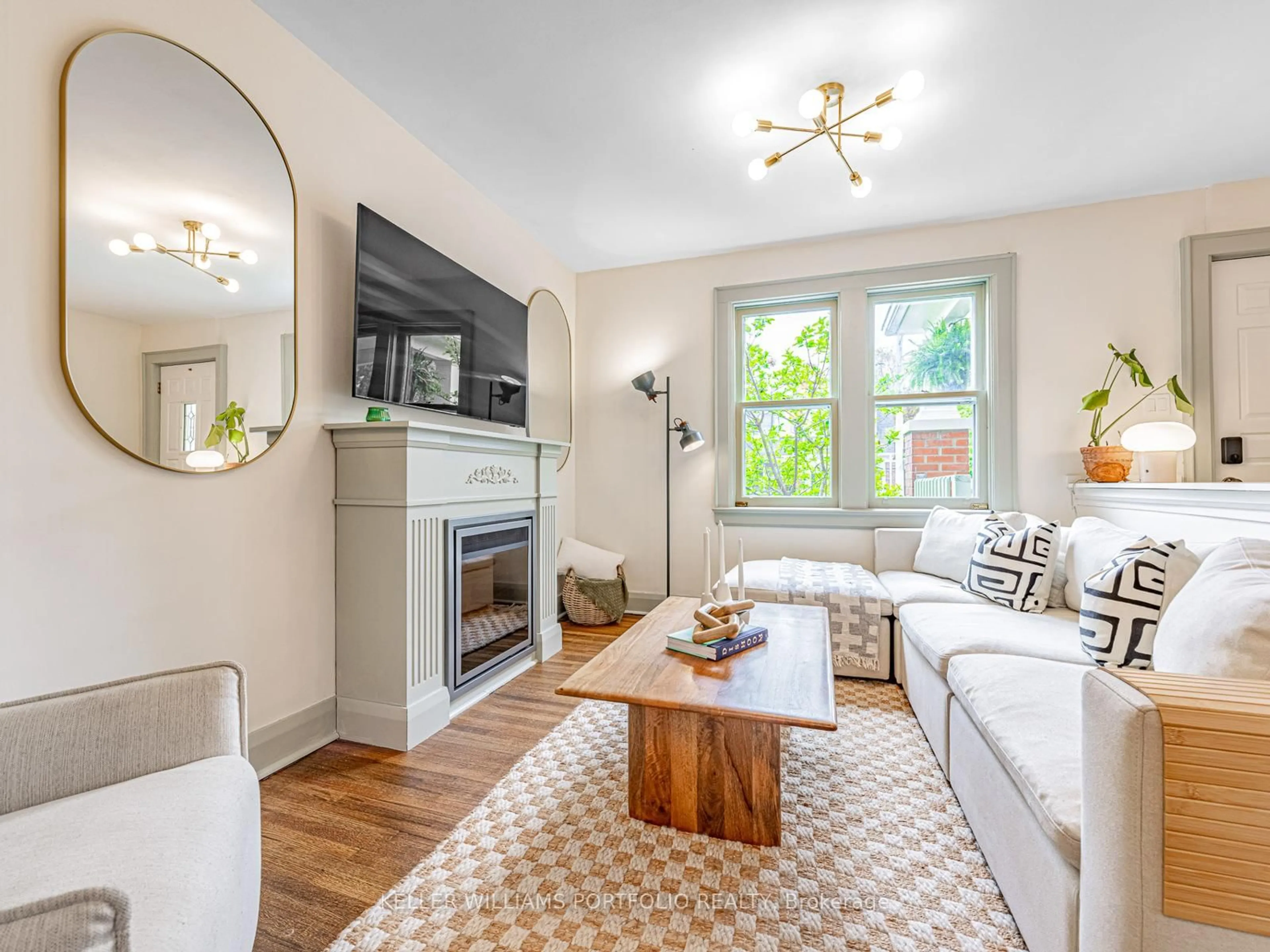 Living room with furniture, wood/laminate floor for 178 Swanwick Ave, Toronto Ontario M4E 2A6