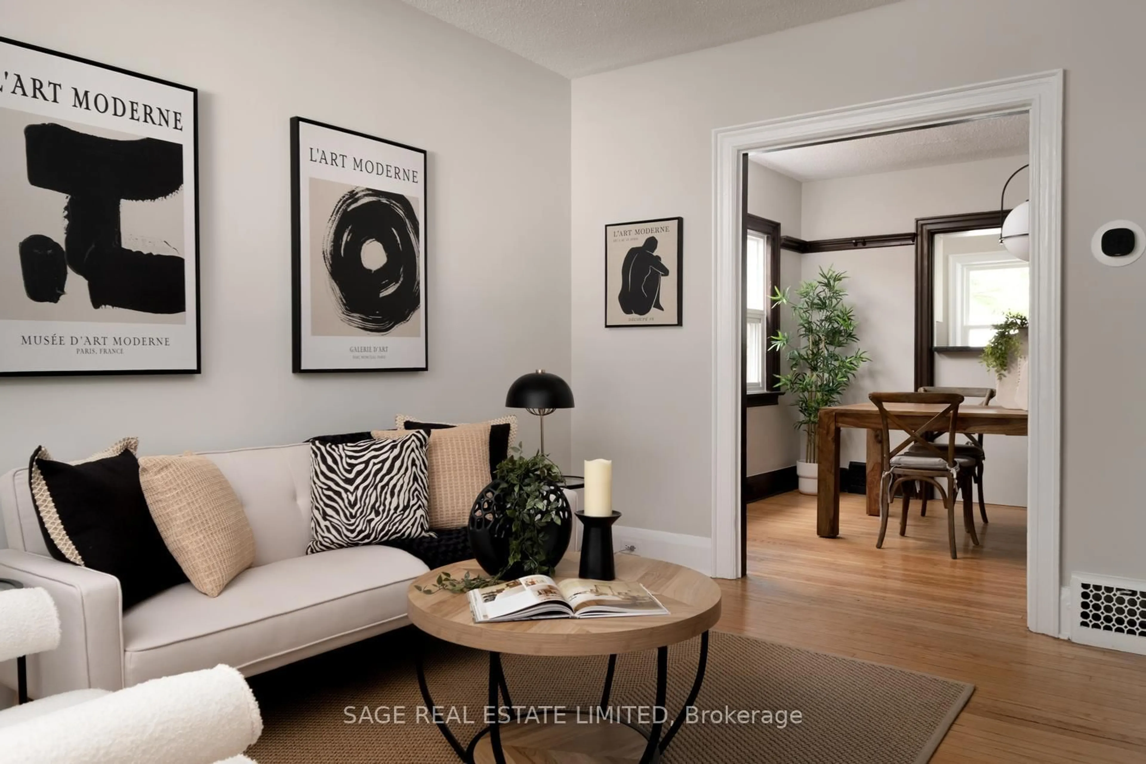 Living room with furniture, wood/laminate floor for 261 Monarch Park Ave, Toronto Ontario M4J 4S6