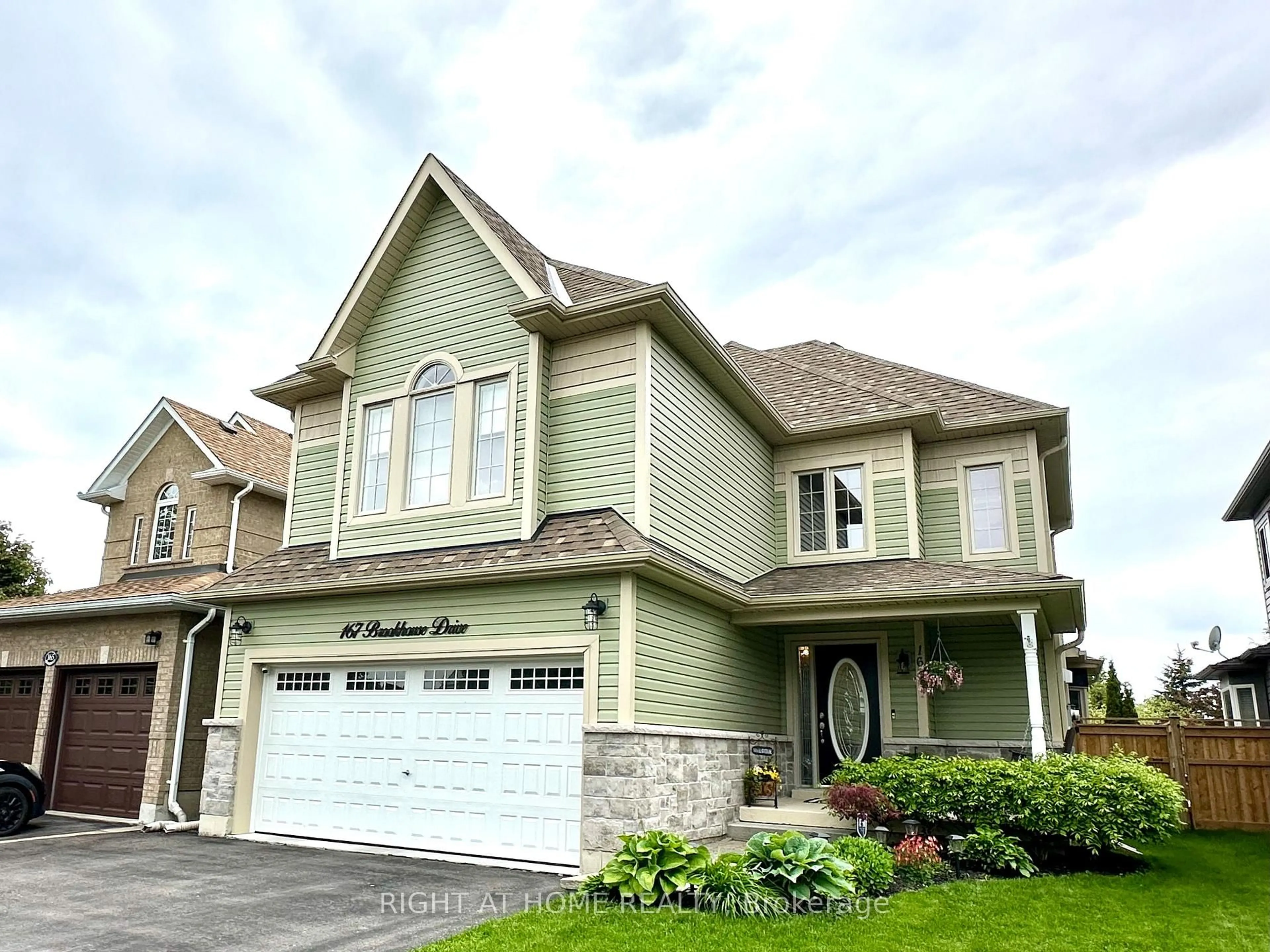 Home with vinyl exterior material, street for 167 Brookhouse Dr, Clarington Ontario L1B 1N9