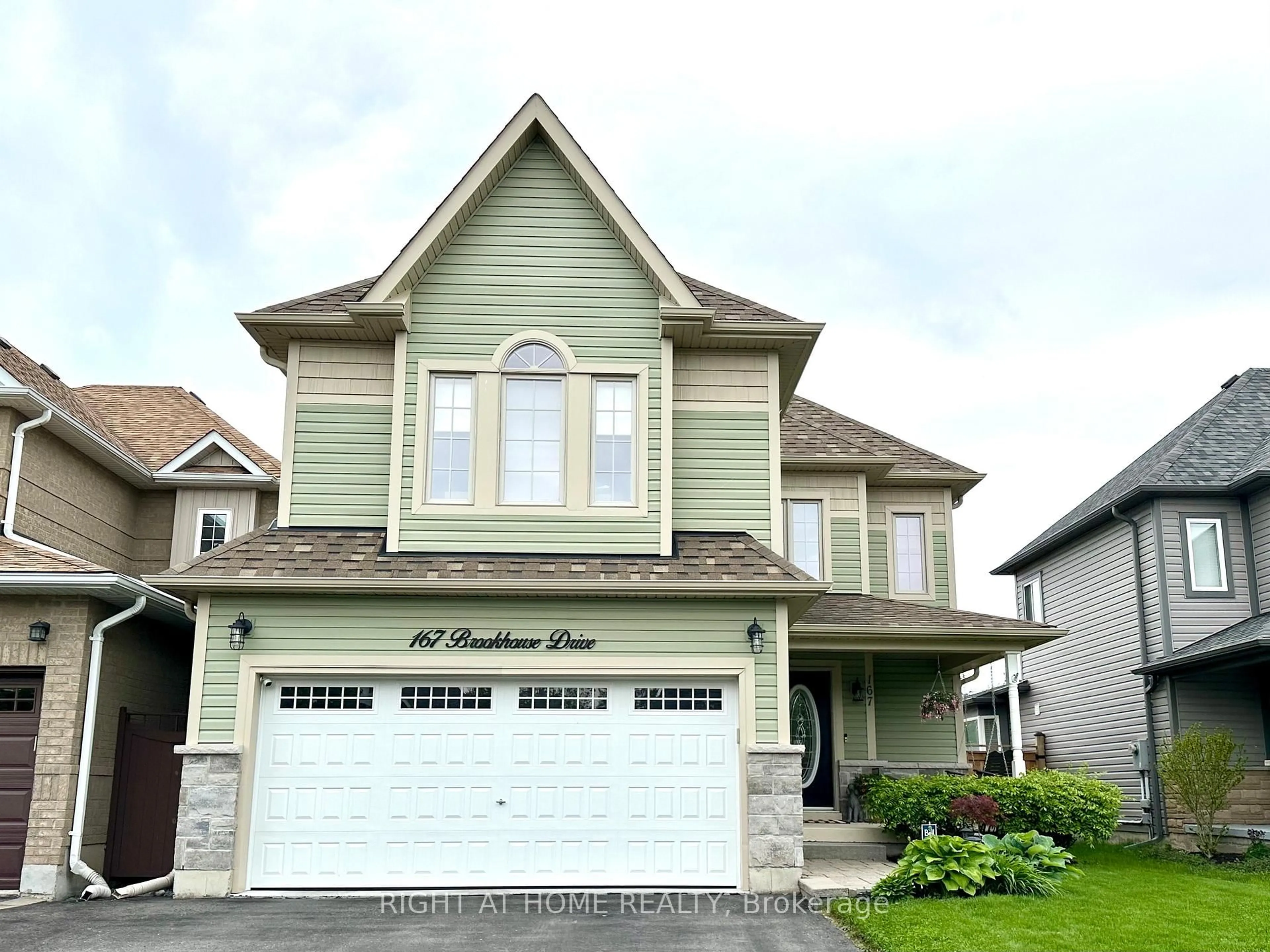 Home with vinyl exterior material, street for 167 Brookhouse Dr, Clarington Ontario L1B 1N9