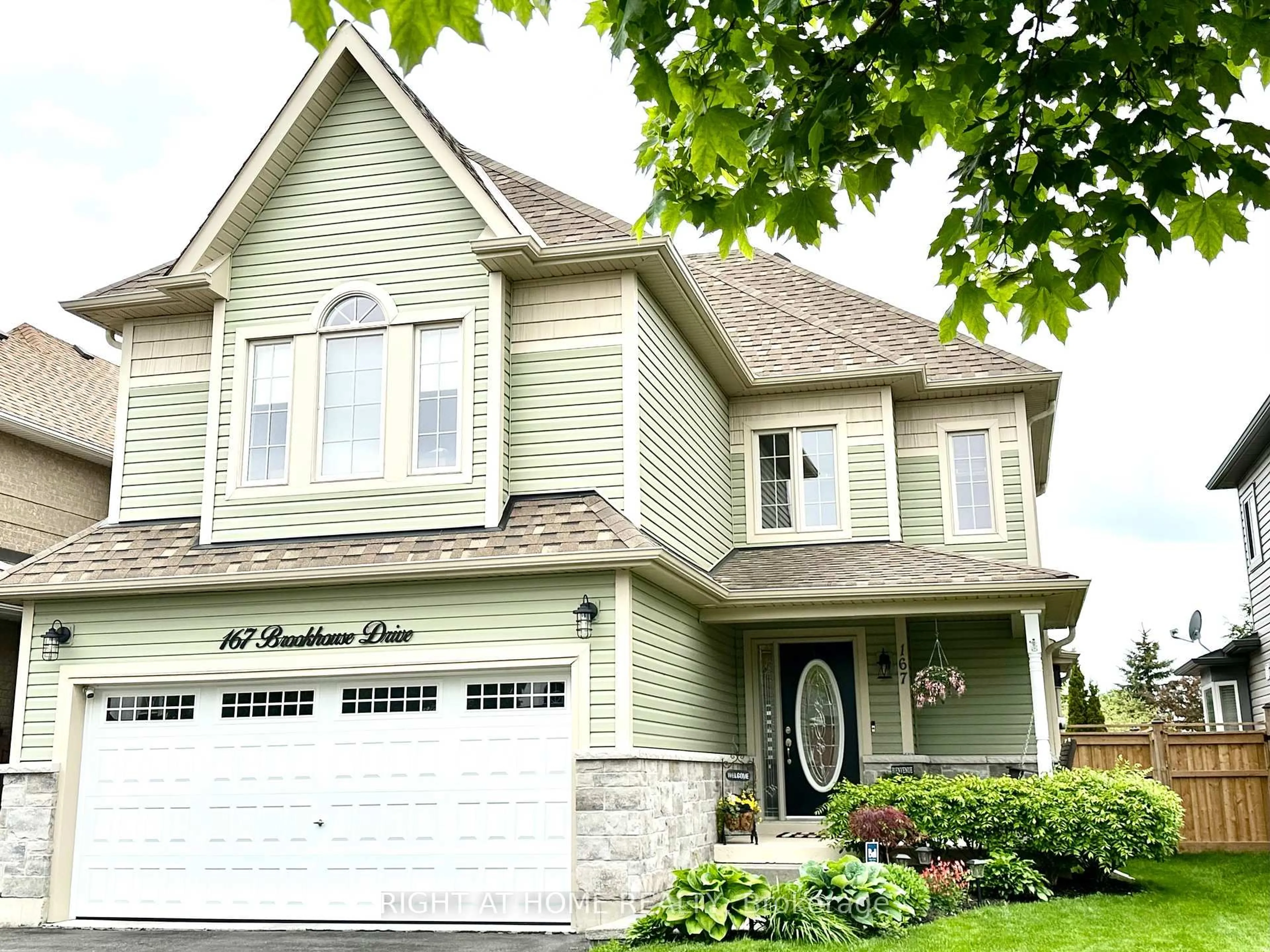 Home with vinyl exterior material, street for 167 Brookhouse Dr, Clarington Ontario L1B 1N9