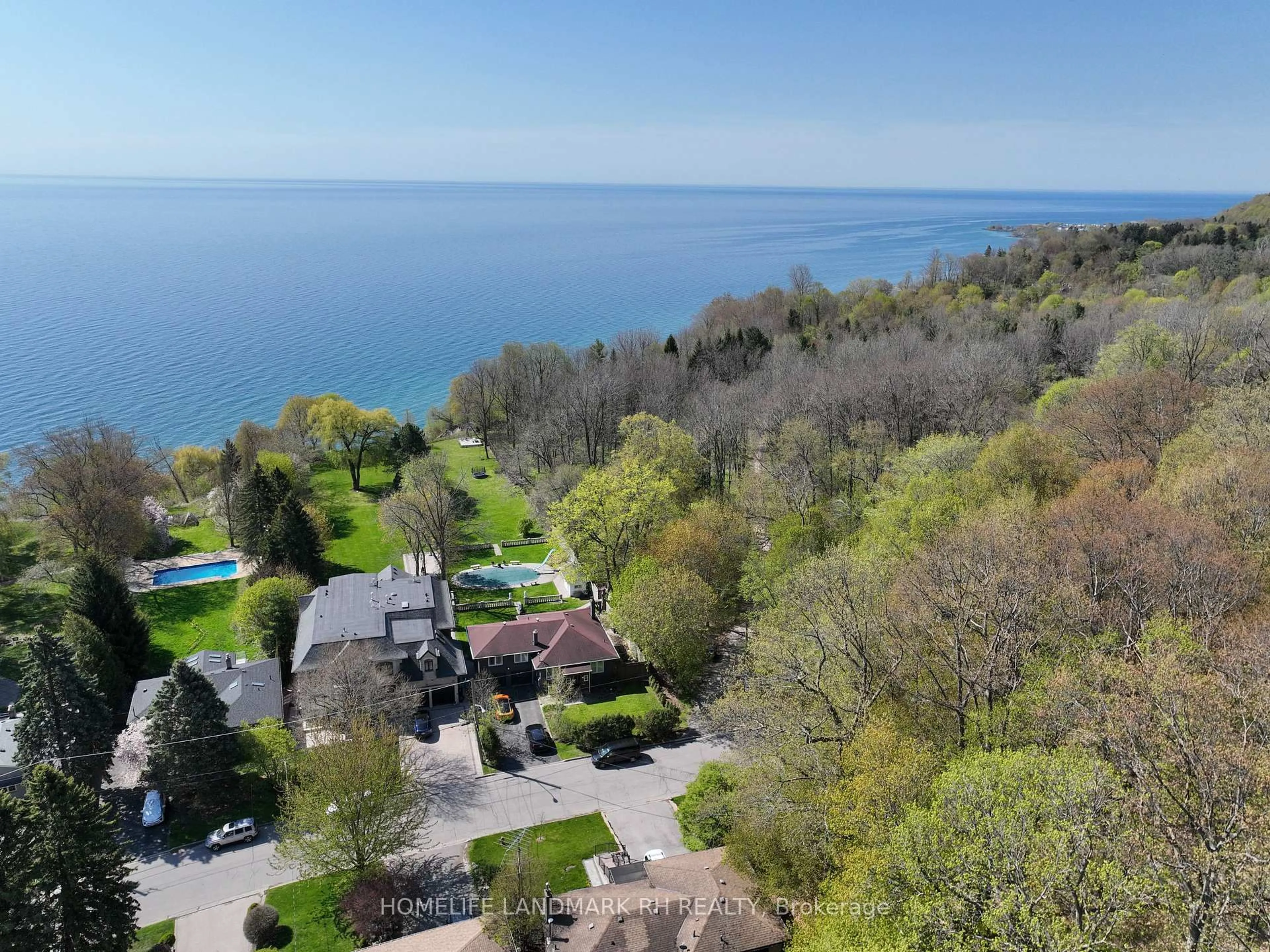 A pic from outside/outdoor area/front of a property/back of a property/a pic from drone, water/lake/river/ocean view for 61 Sylvan Ave, Toronto Ontario M1M 1J9
