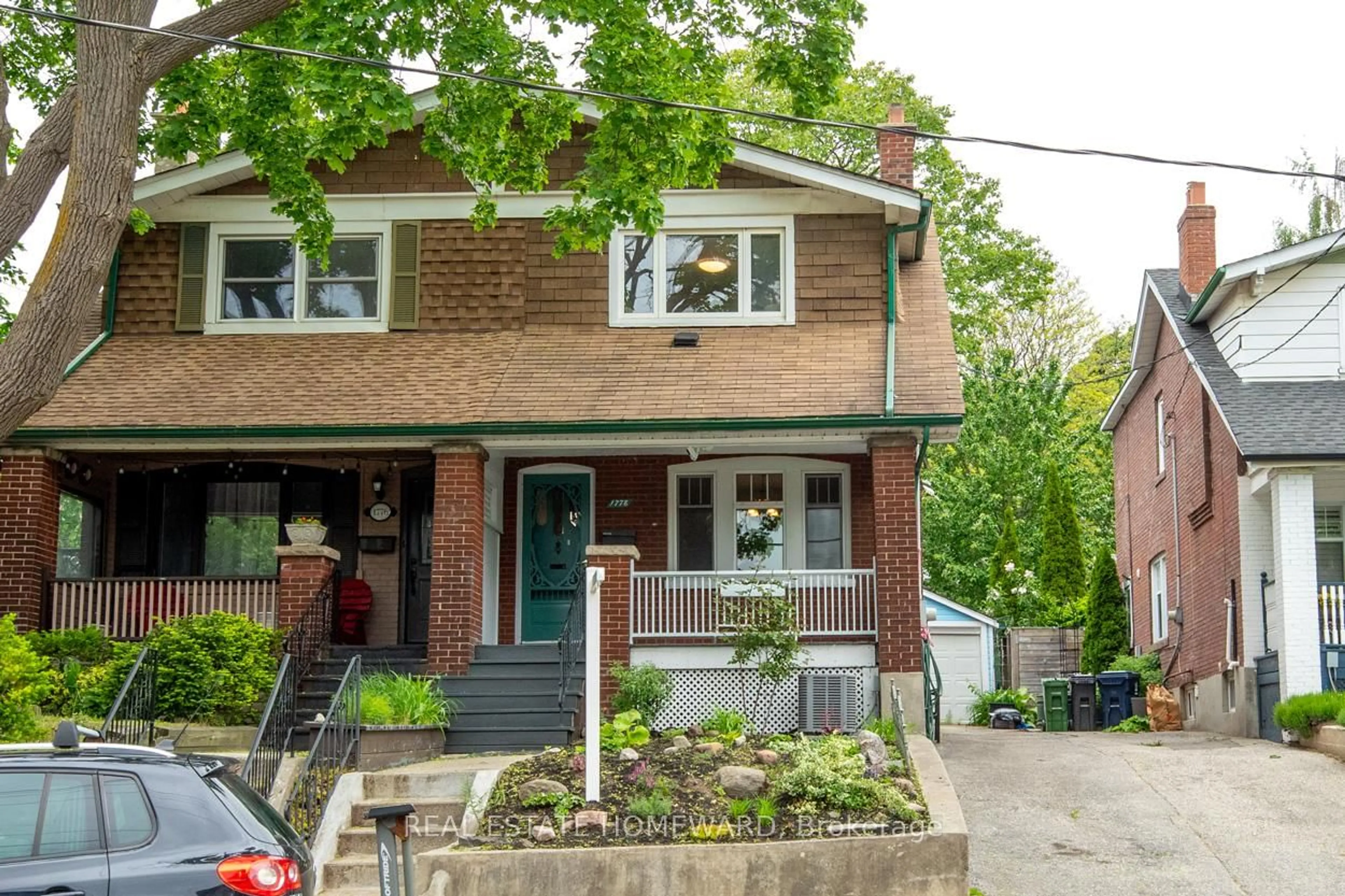 Home with brick exterior material, street for 1778 Gerrard St, Toronto Ontario M4L 2B4