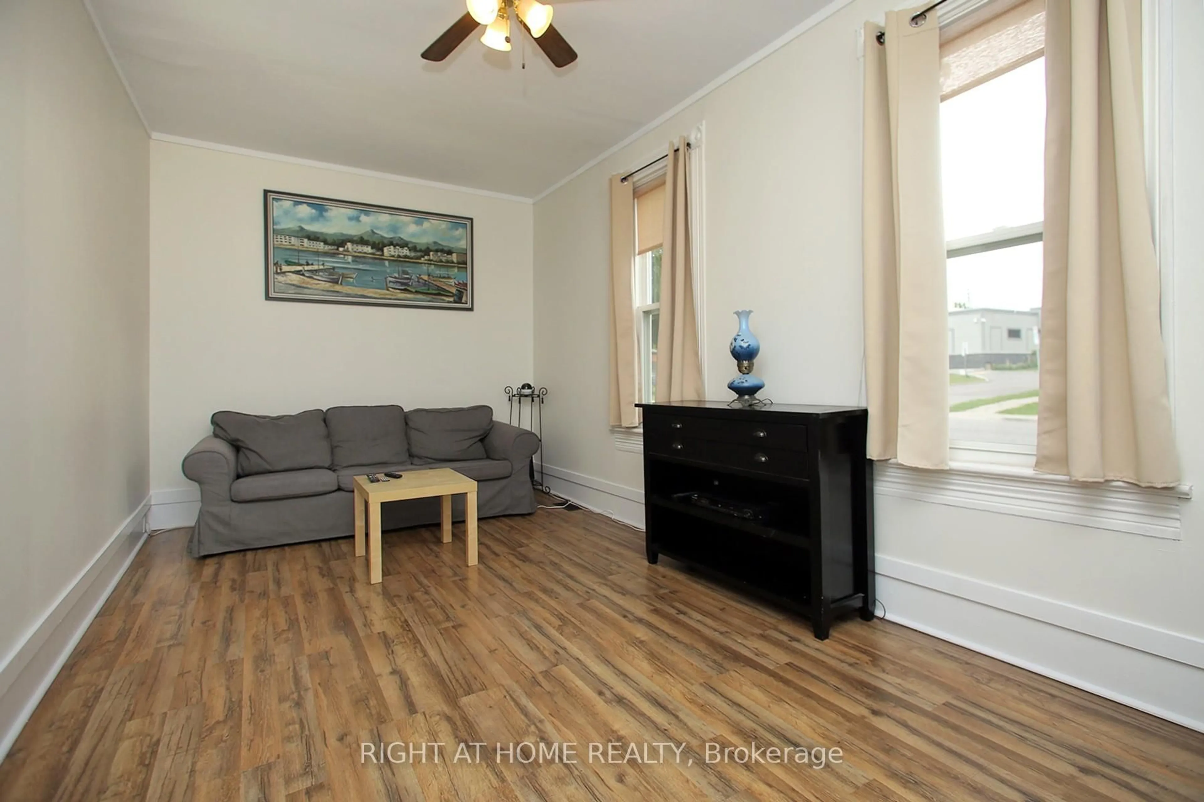 Living room with furniture, wood/laminate floor for 217 Celina St, Oshawa Ontario L1H 4N7