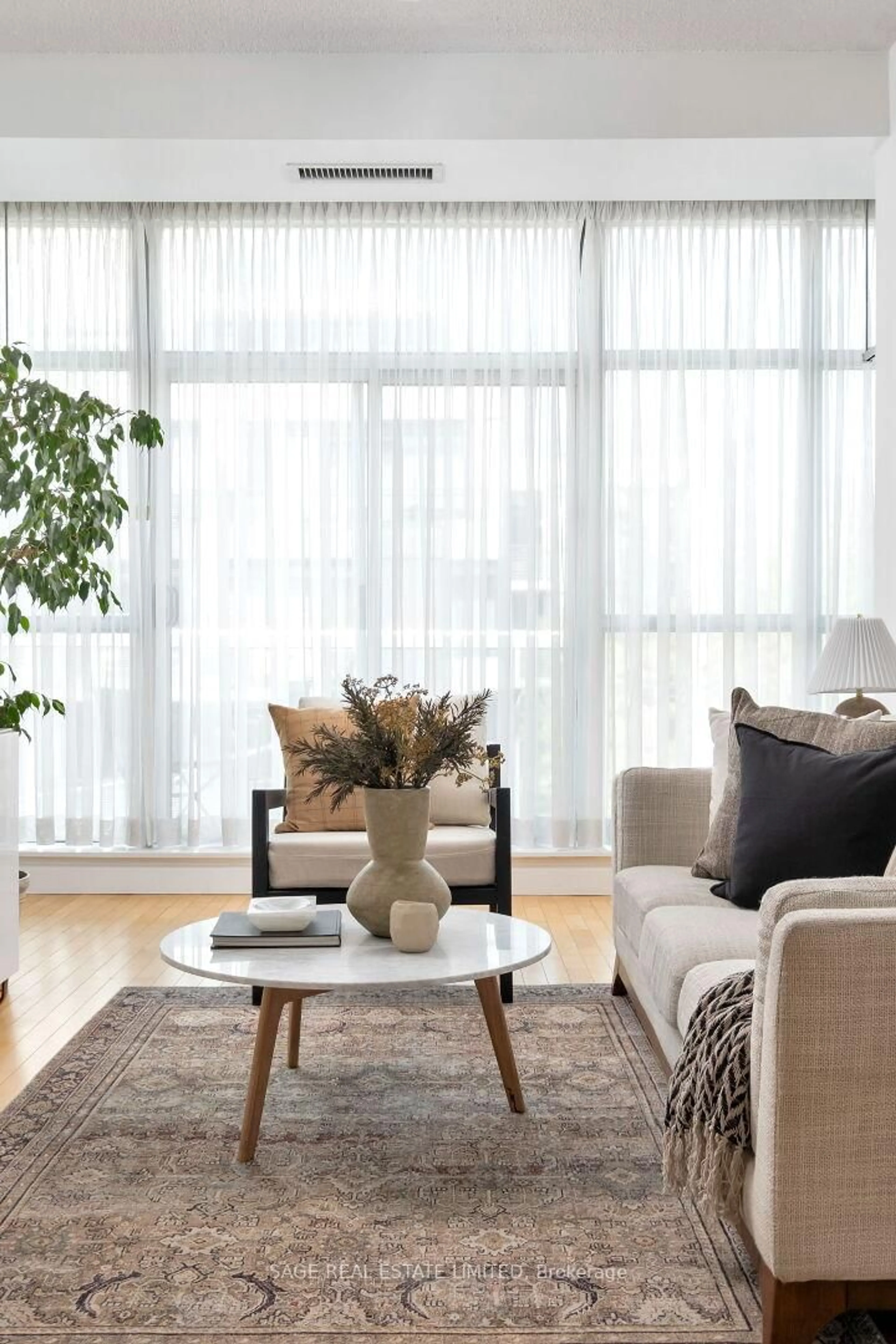 Living room with furniture, wood/laminate floor for 601 Kingston Rd #512, Toronto Ontario M4E 3Y2
