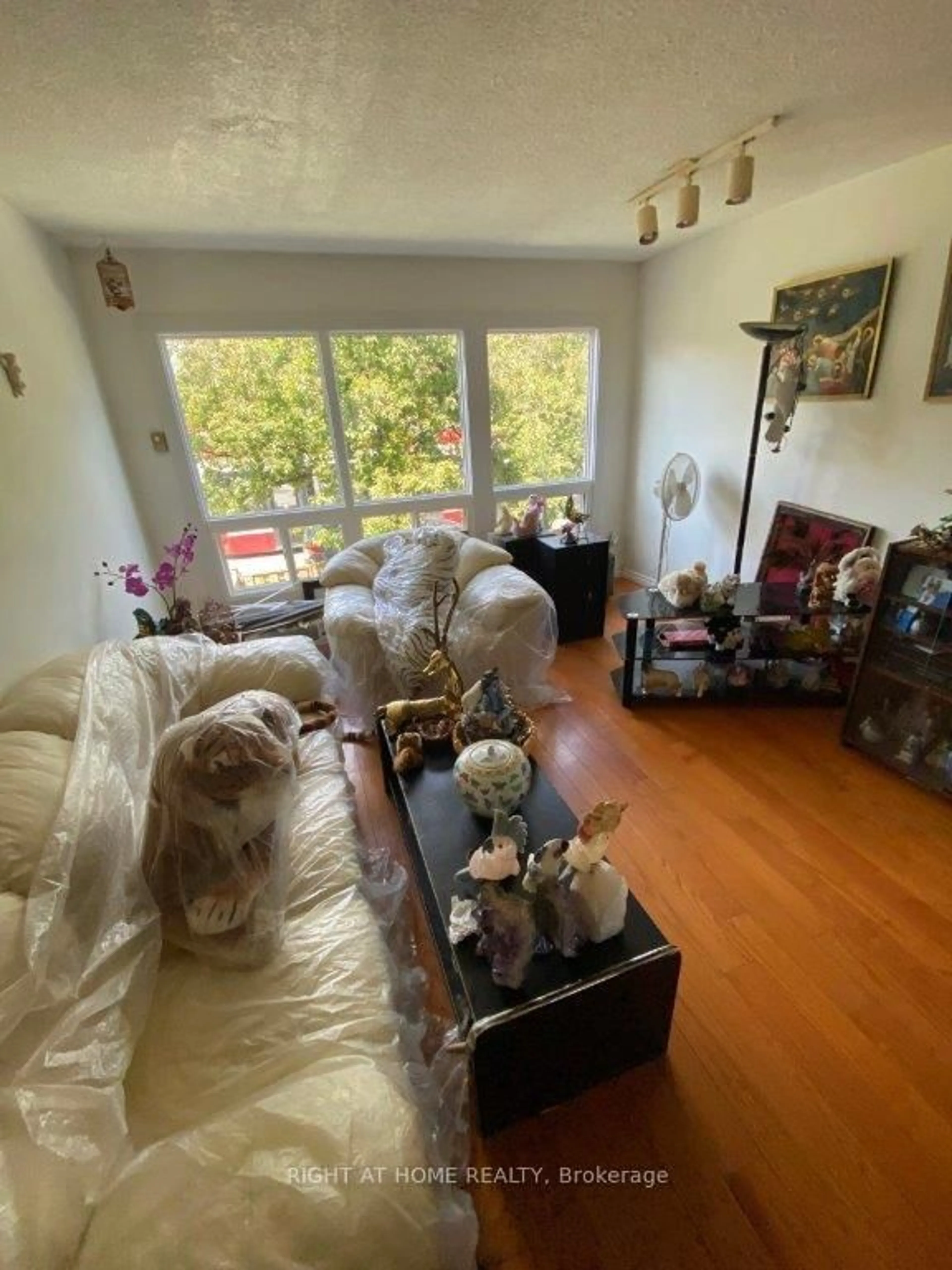 Living room with furniture, floor is not visible for 1209 Queen St #5, Toronto Ontario M4M 3H4