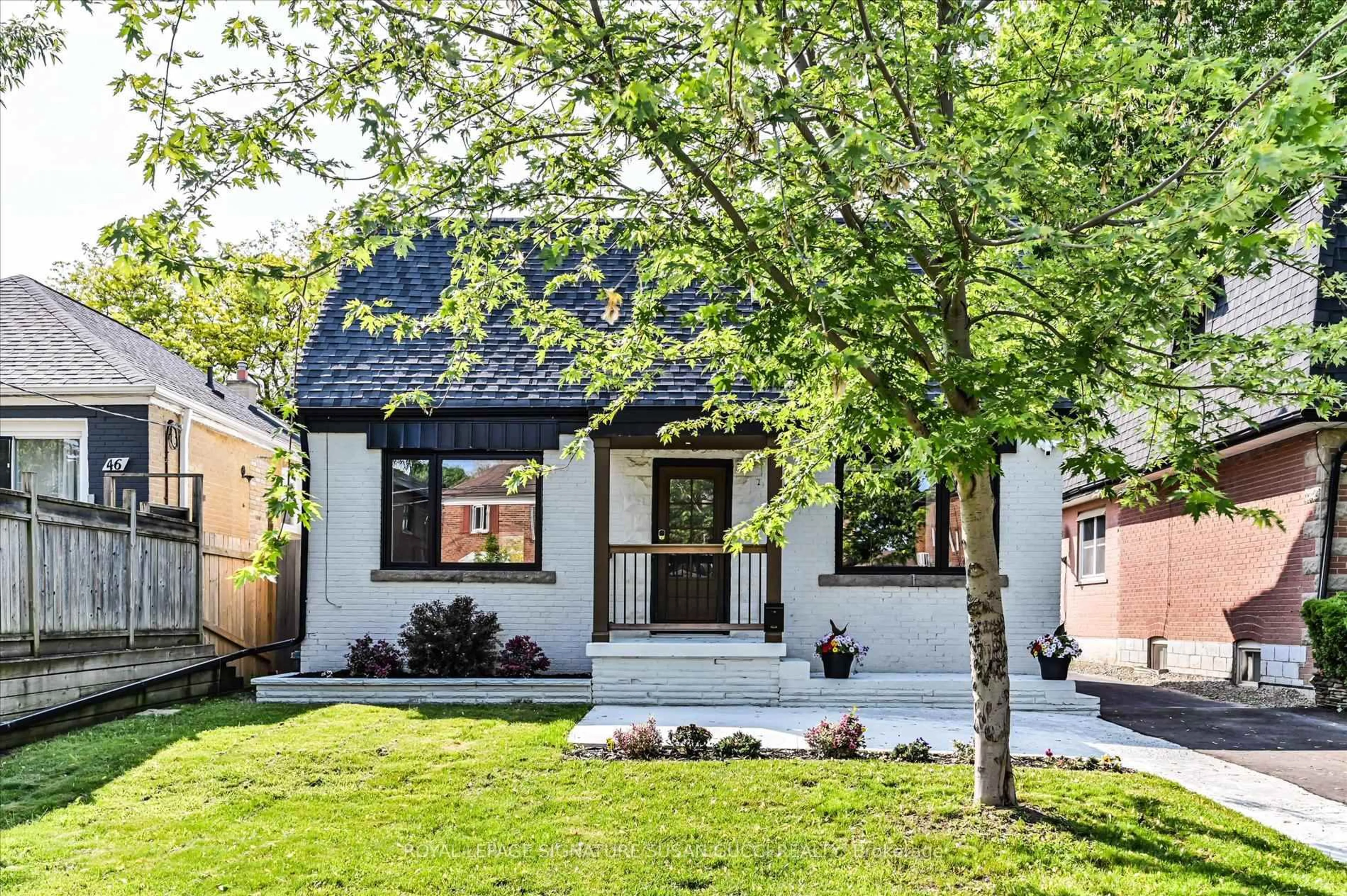 Home with brick exterior material, street for 48 Denvale Rd, Toronto Ontario M4B 3B7
