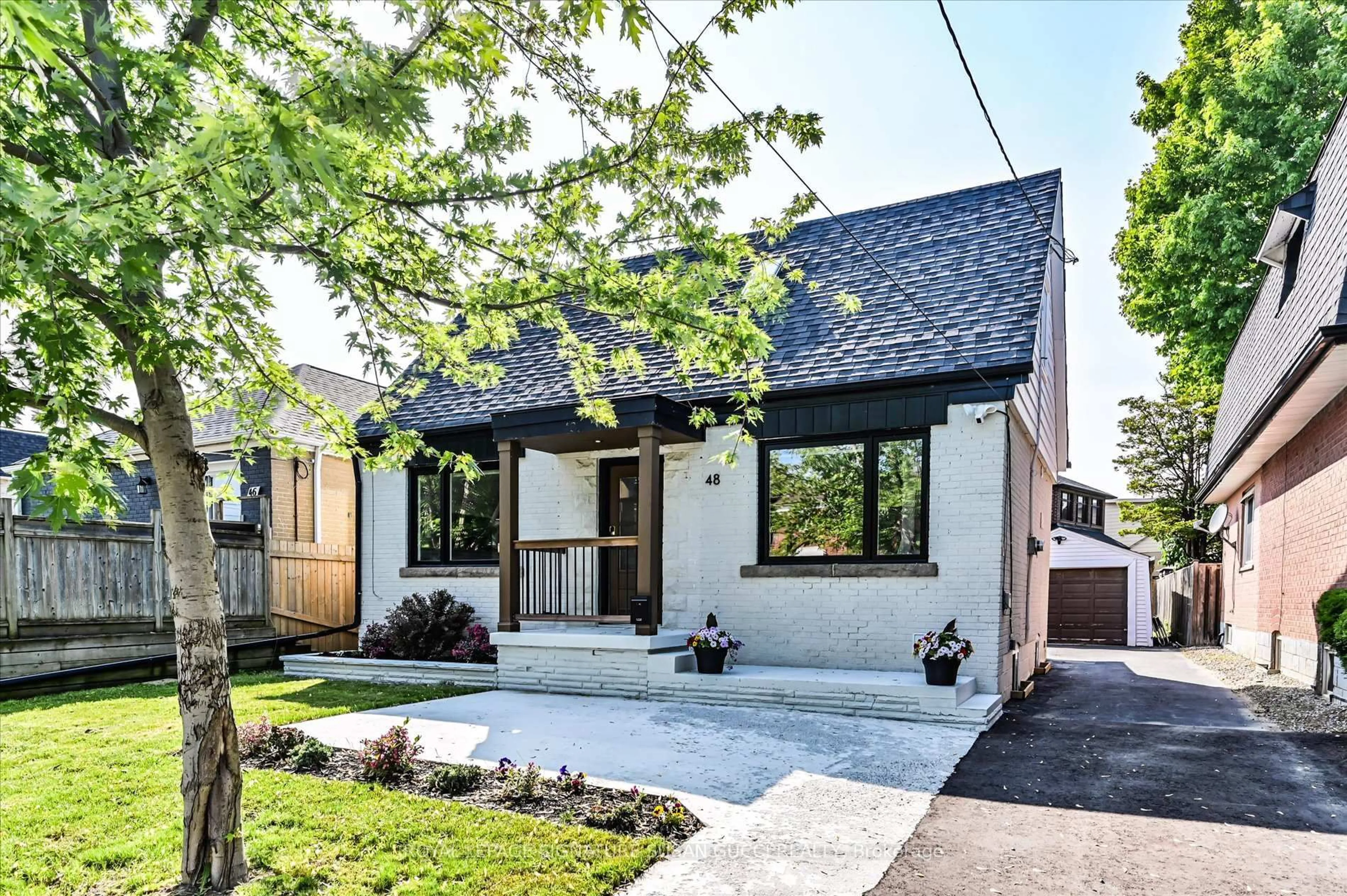 Home with brick exterior material, street for 48 Denvale Rd, Toronto Ontario M4B 3B7