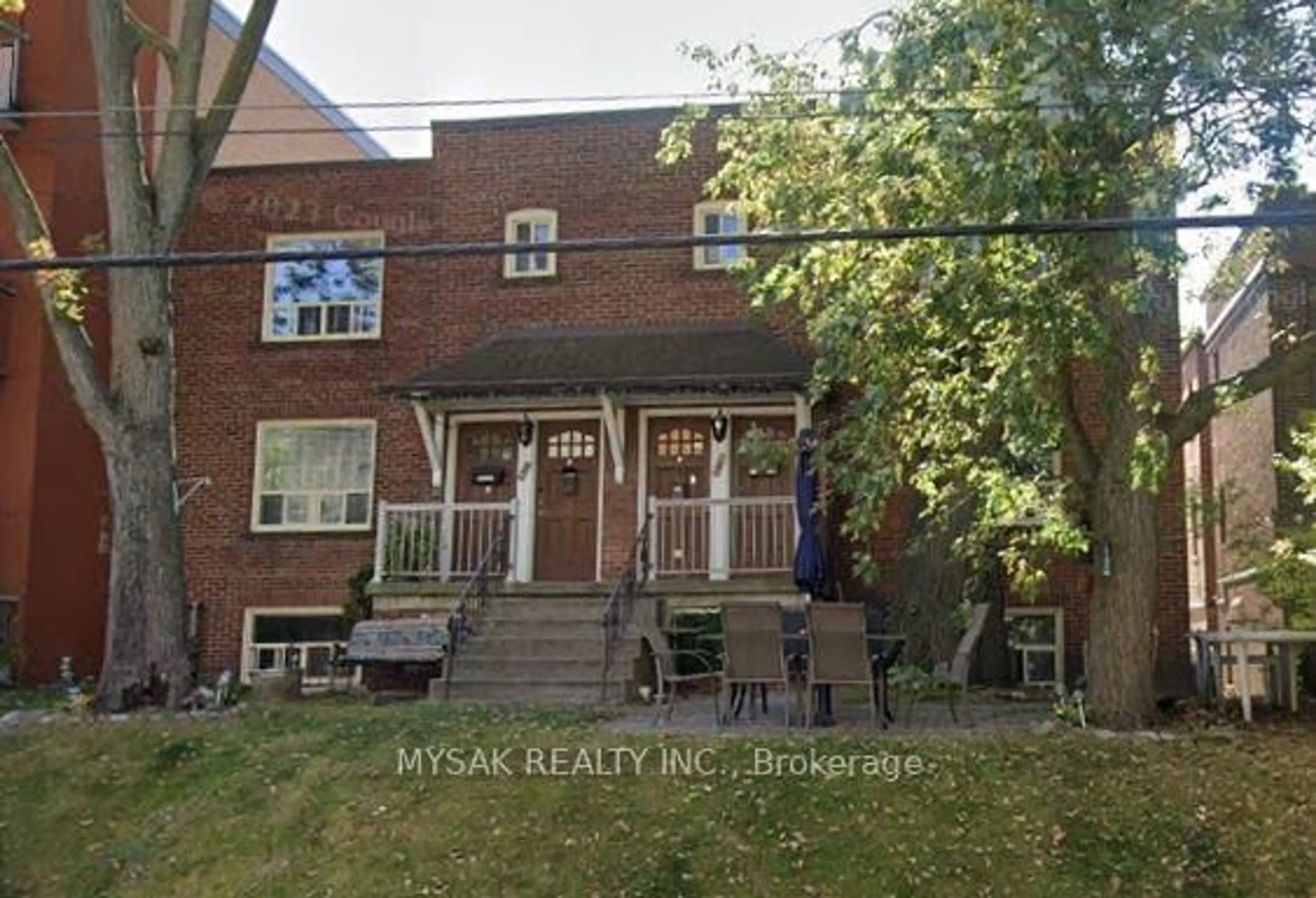Home with brick exterior material, street for 2369 Queen St, Toronto Ontario M4E 1H2