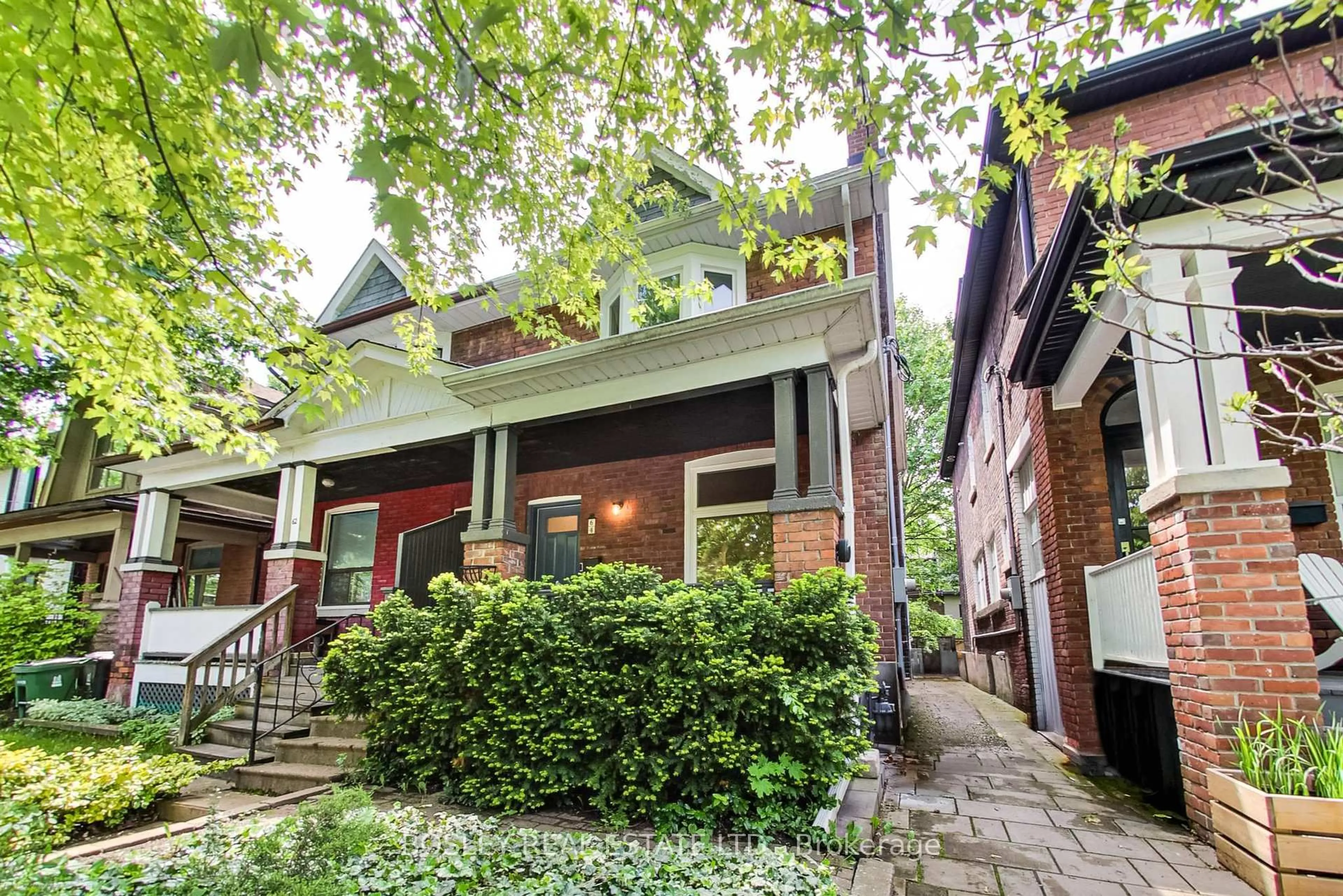 Home with brick exterior material, street for 64 Coady Ave, Toronto Ontario M4M 2Y8