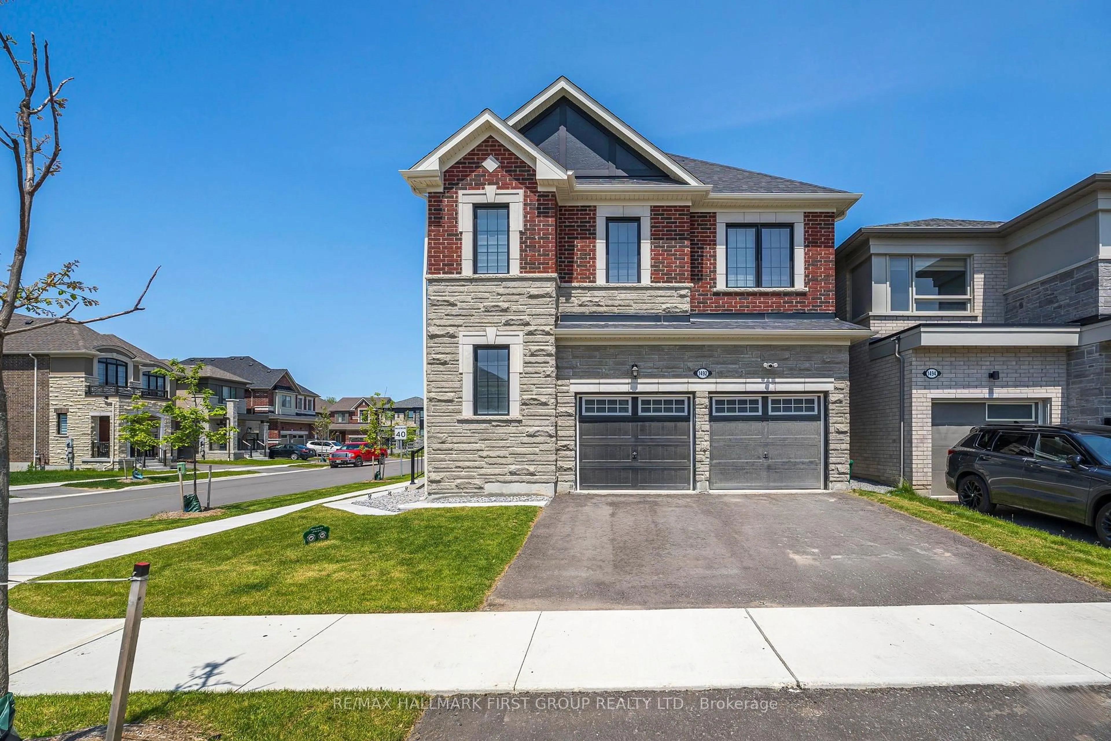Home with brick exterior material, street for 1492 Hawktail Path, Pickering Ontario L1X 0N9
