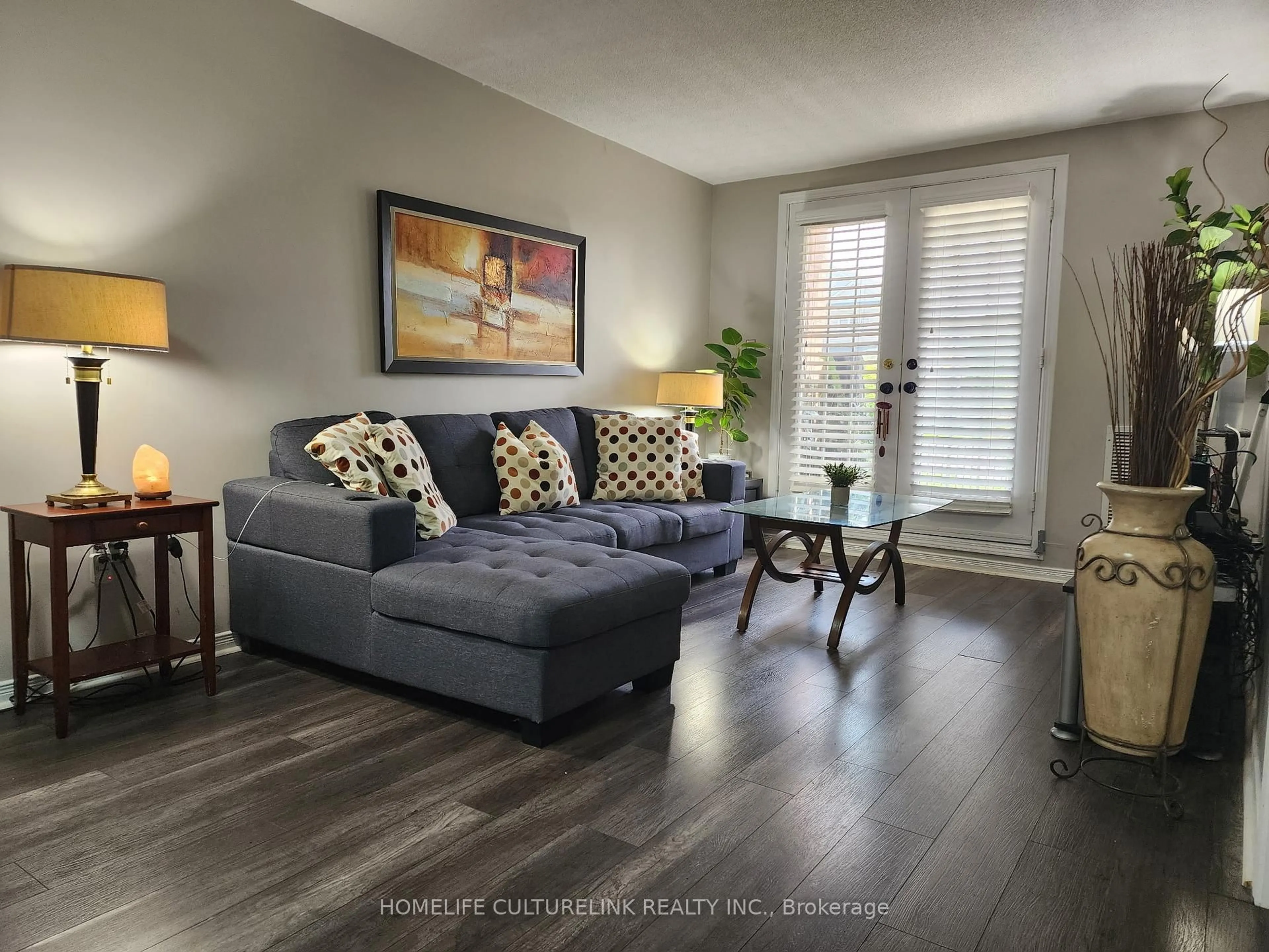 Living room with furniture, wood/laminate floor for 84 Petra 1 Way, Whitby Ontario L1R 0A3