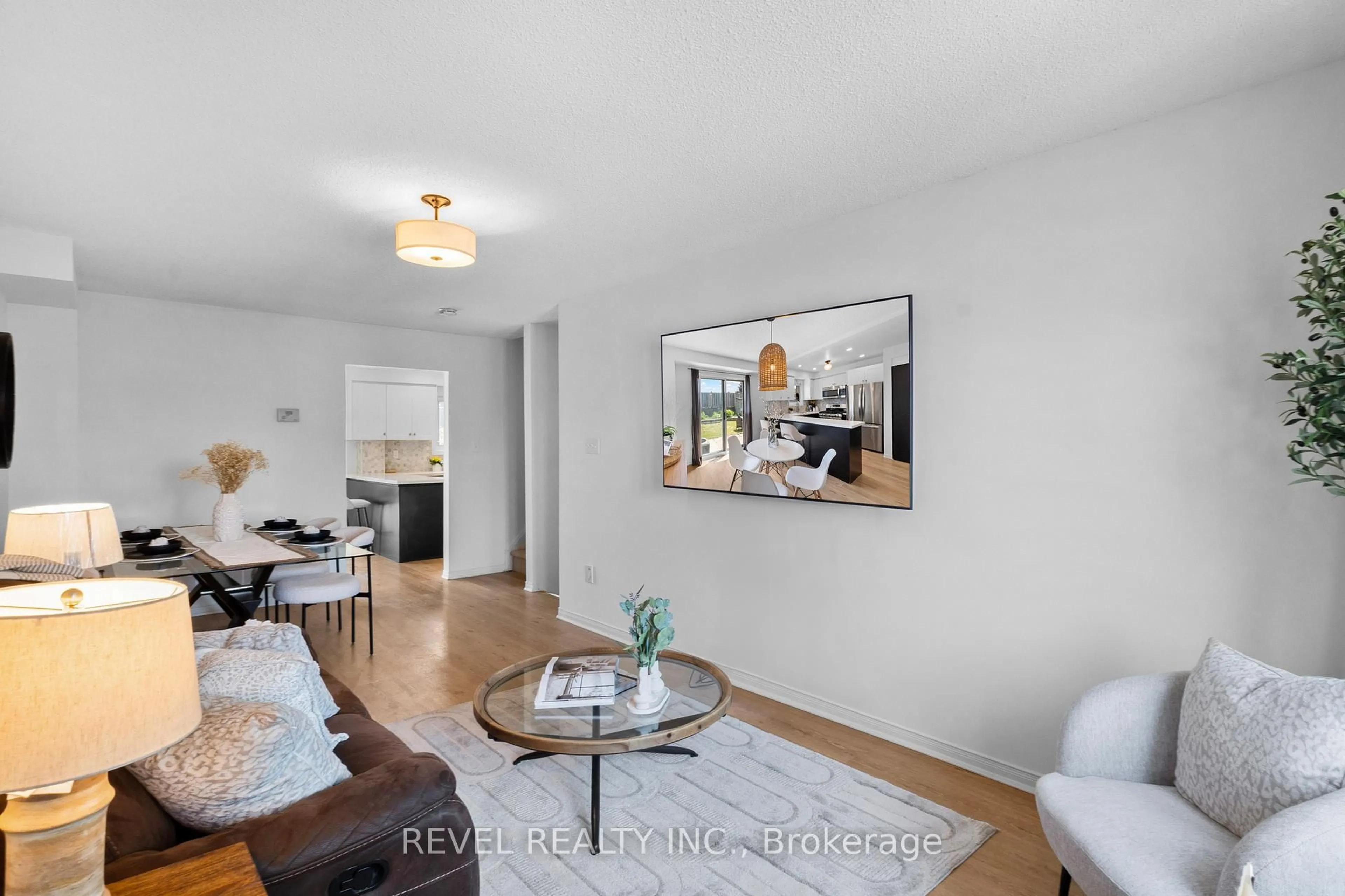 Living room with furniture, wood/laminate floor for 1801 Nichol Ave Ave #7, Whitby Ontario L1N 9K1