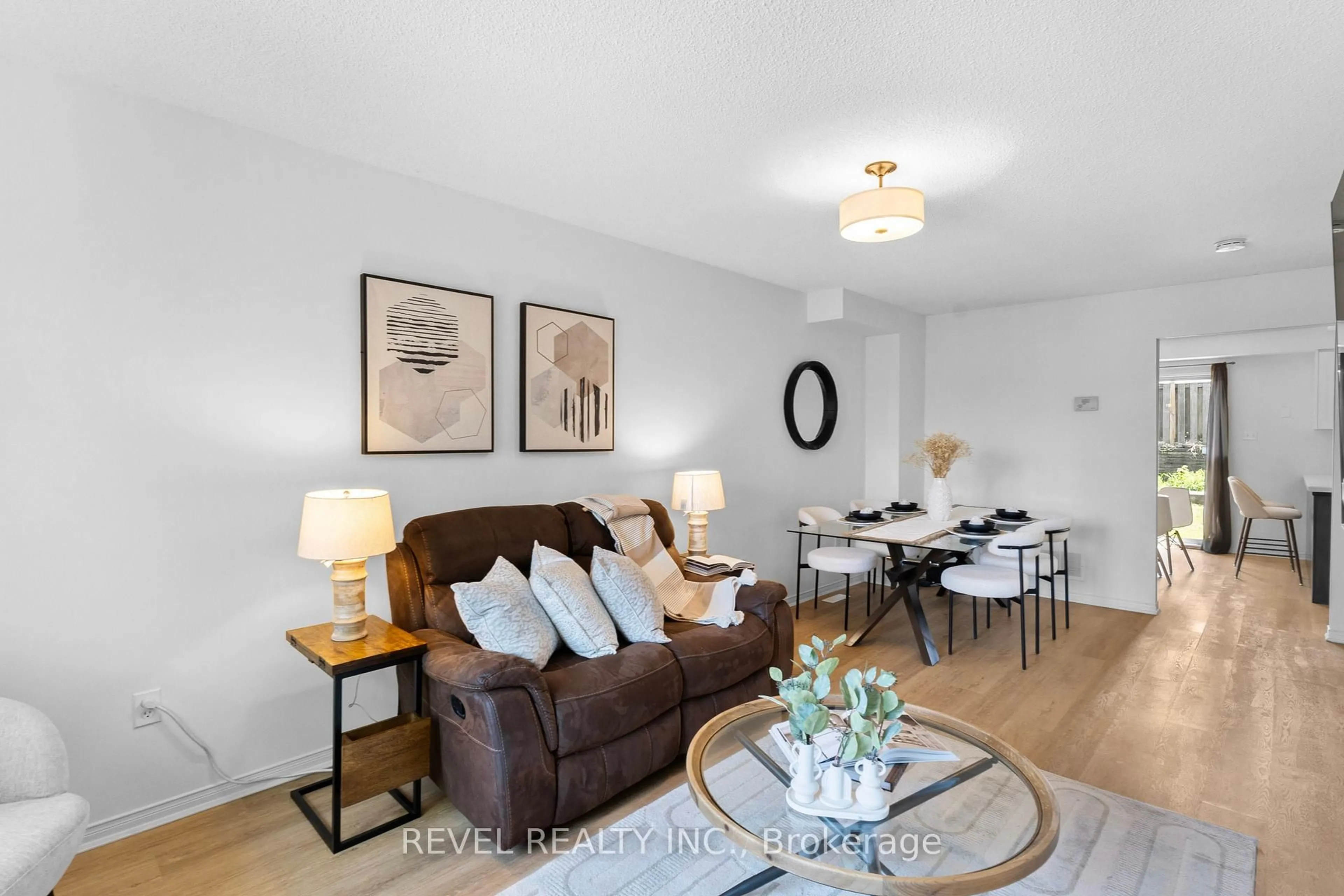 Living room with furniture, wood/laminate floor for 1801 Nichol Ave Ave #7, Whitby Ontario L1N 9K1