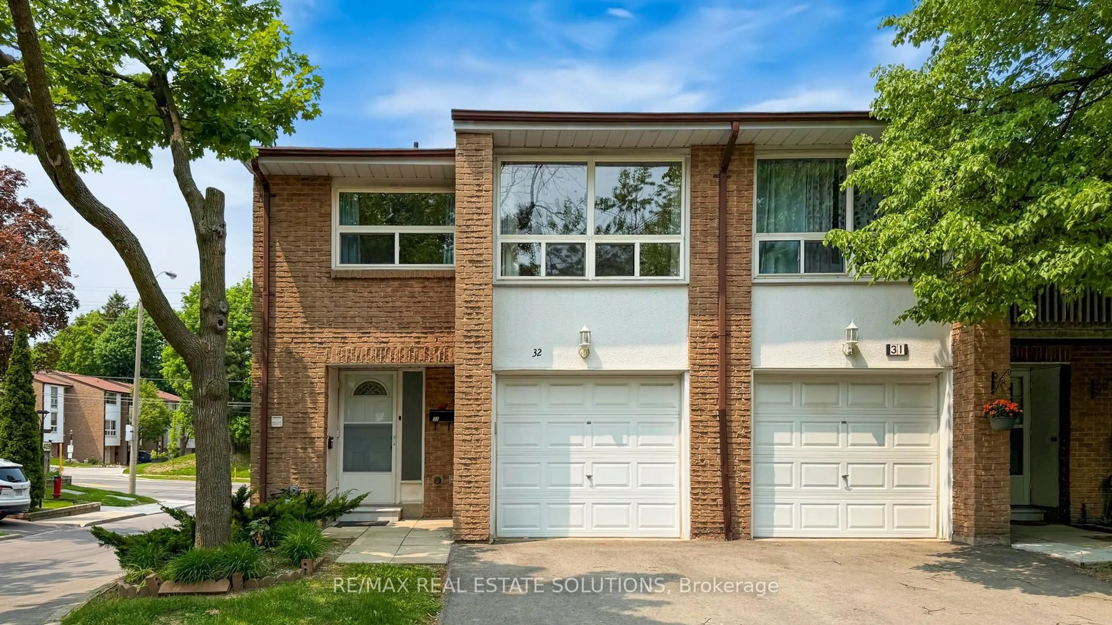 Home with brick exterior material, street for 3409 St Clair Ave #32, Toronto Ontario M1L 1W3