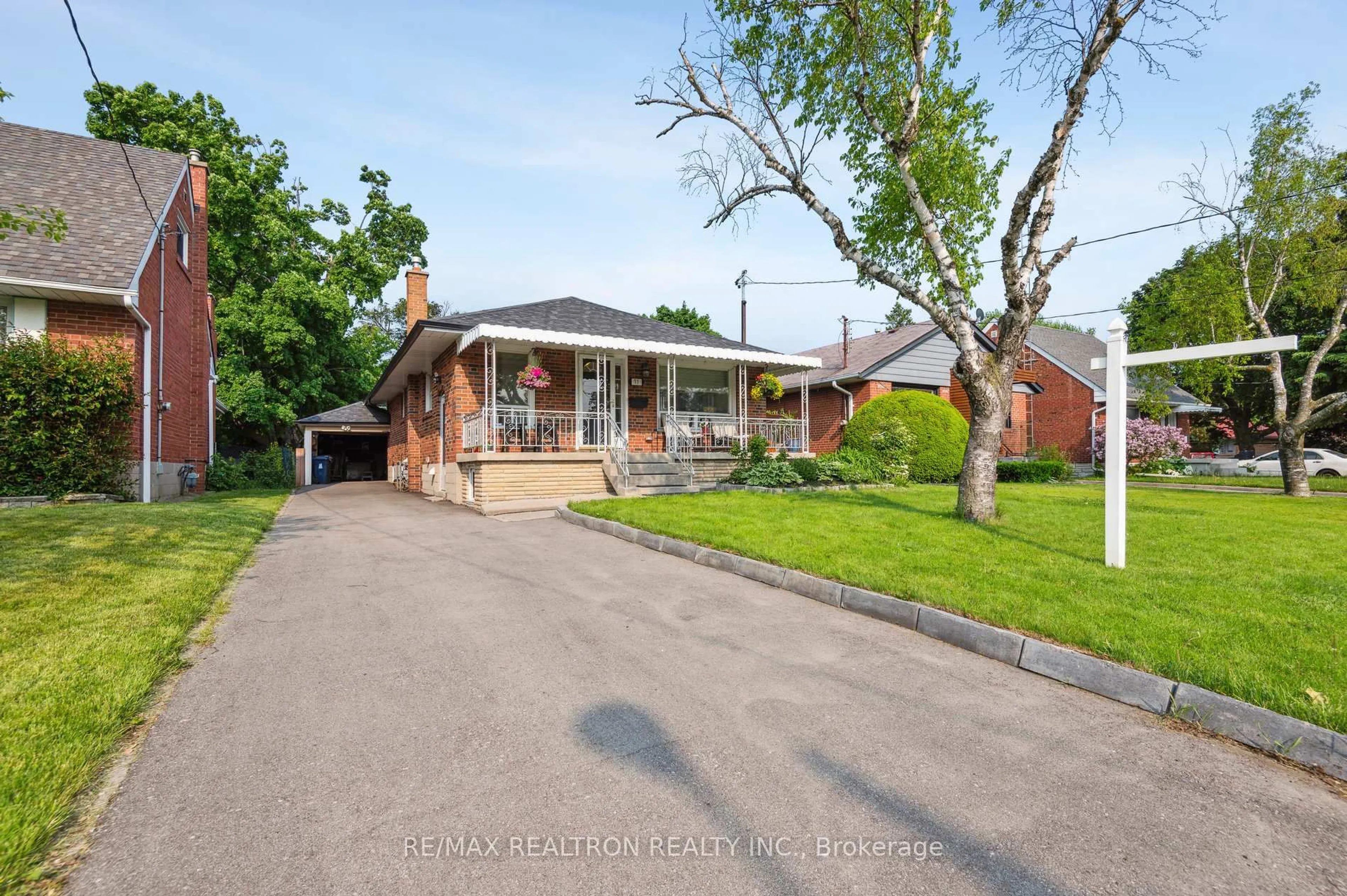 Home with brick exterior material, street for 77 Waringstown Dr, Toronto Ontario M1R 4H5
