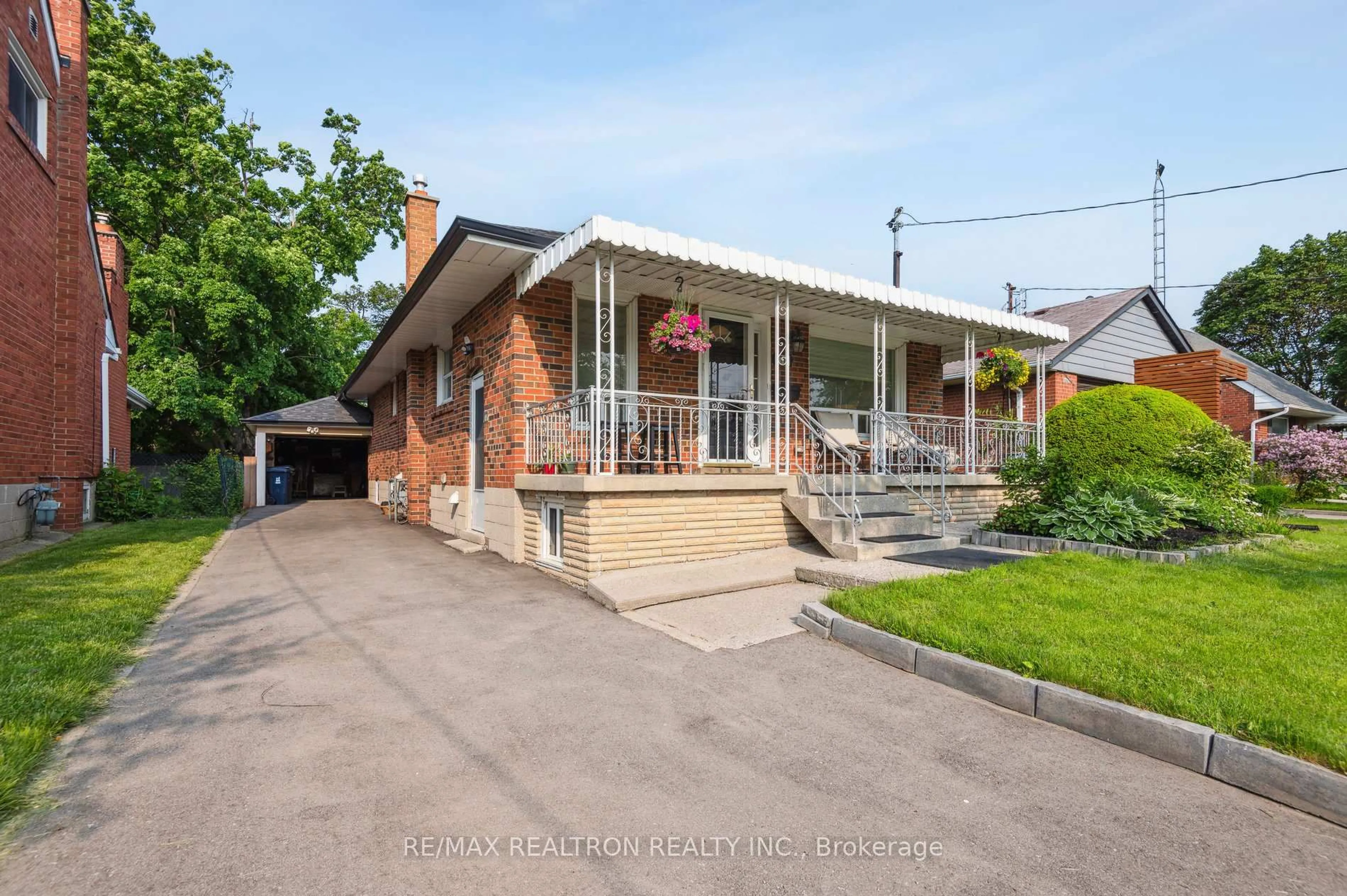 Home with brick exterior material, street for 77 Waringstown Dr, Toronto Ontario M1R 4H5
