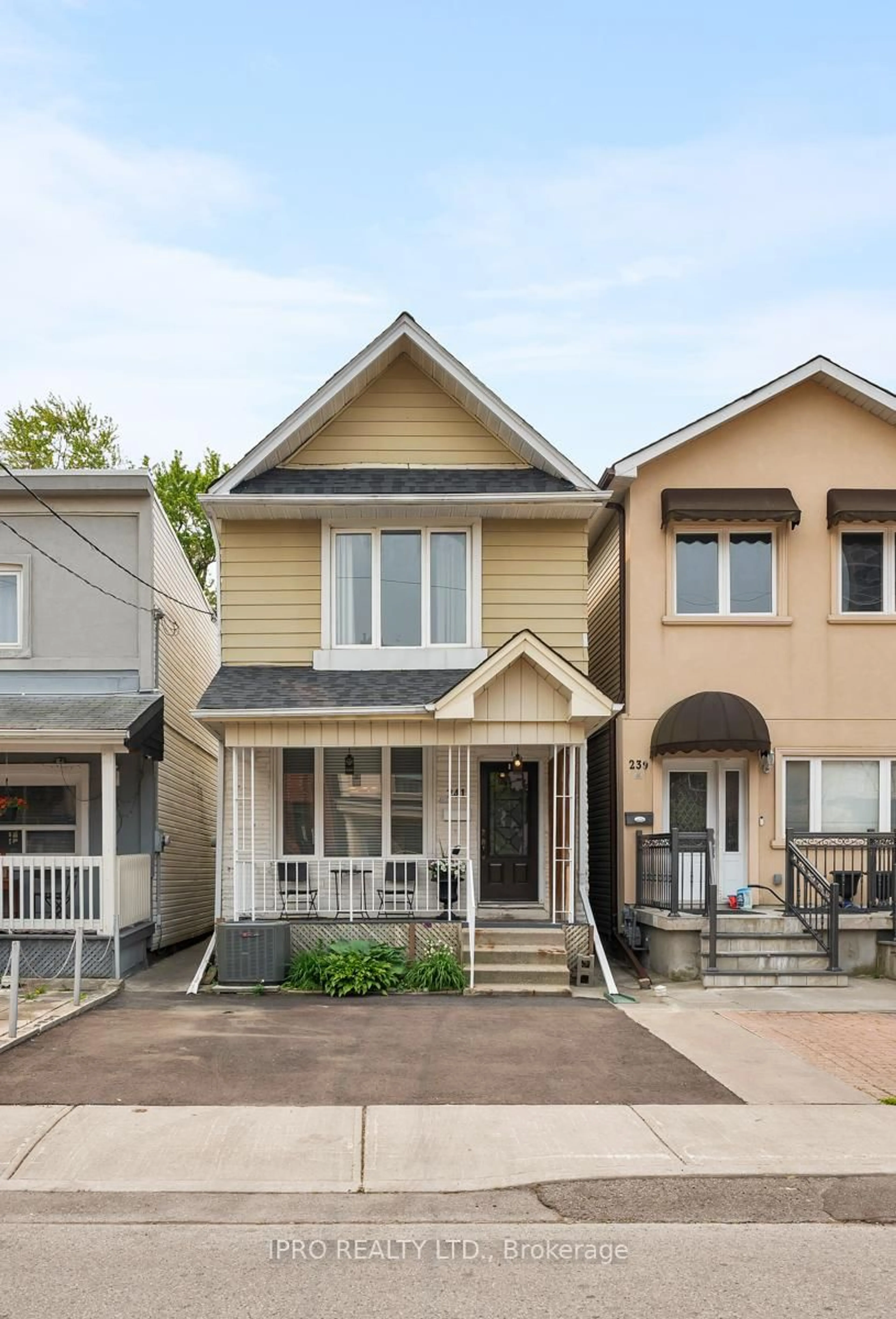 Home with vinyl exterior material, street for 241 Gowan Ave, Toronto Ontario M4J 2K7