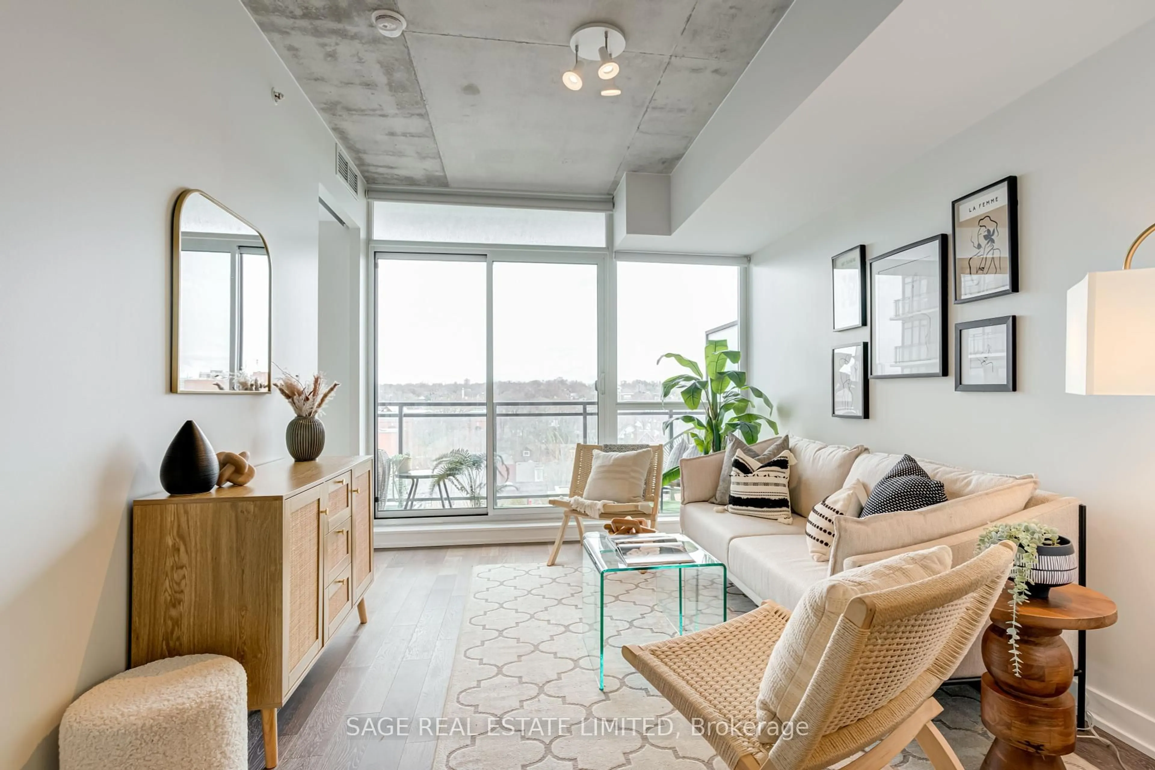 Living room with furniture, cement floor for 1190 Dundas St #804, Toronto Ontario M4M 0C5