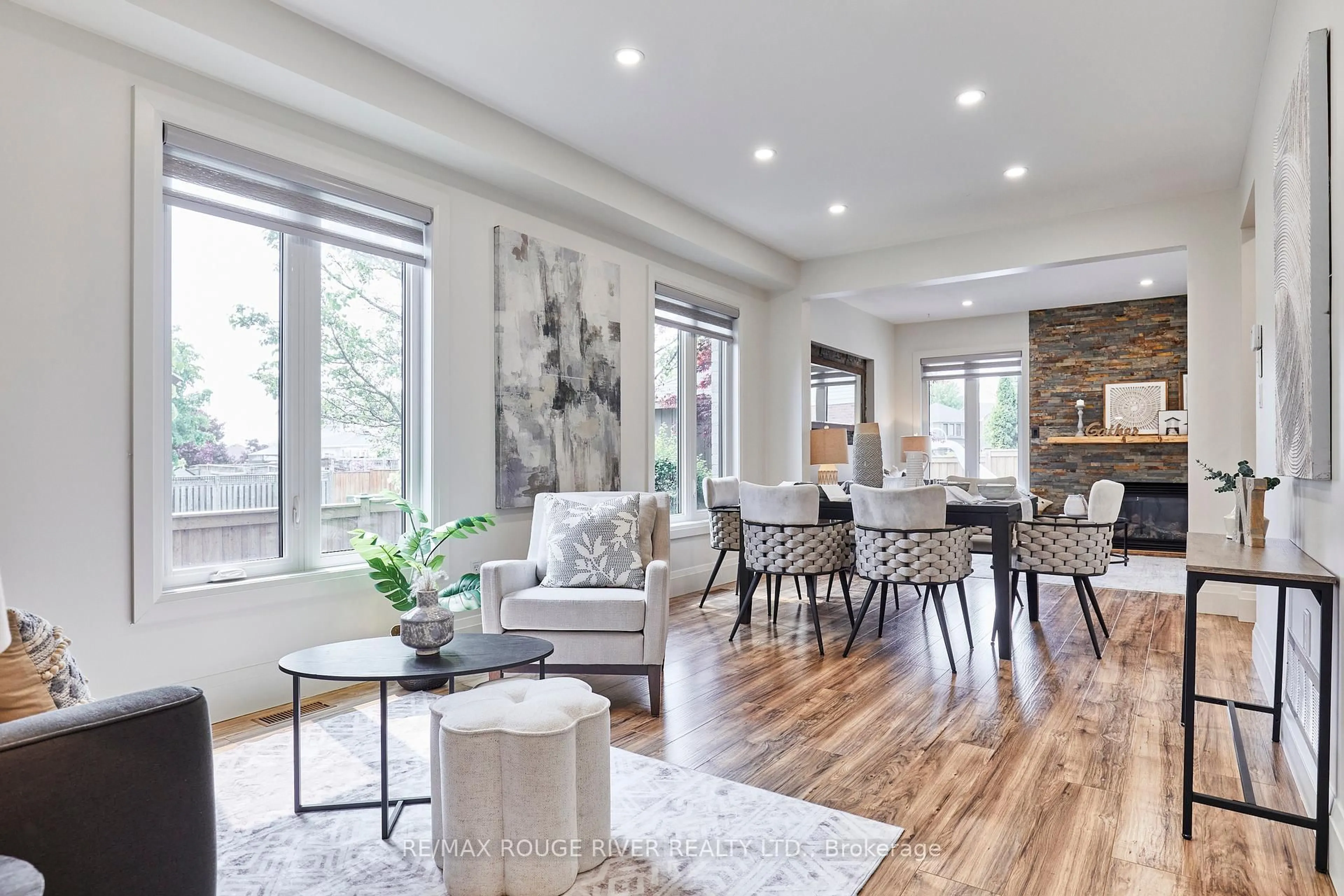 Living room with furniture, wood/laminate floor for 50 West Side Dr, Clarington Ontario L1C 4Y8