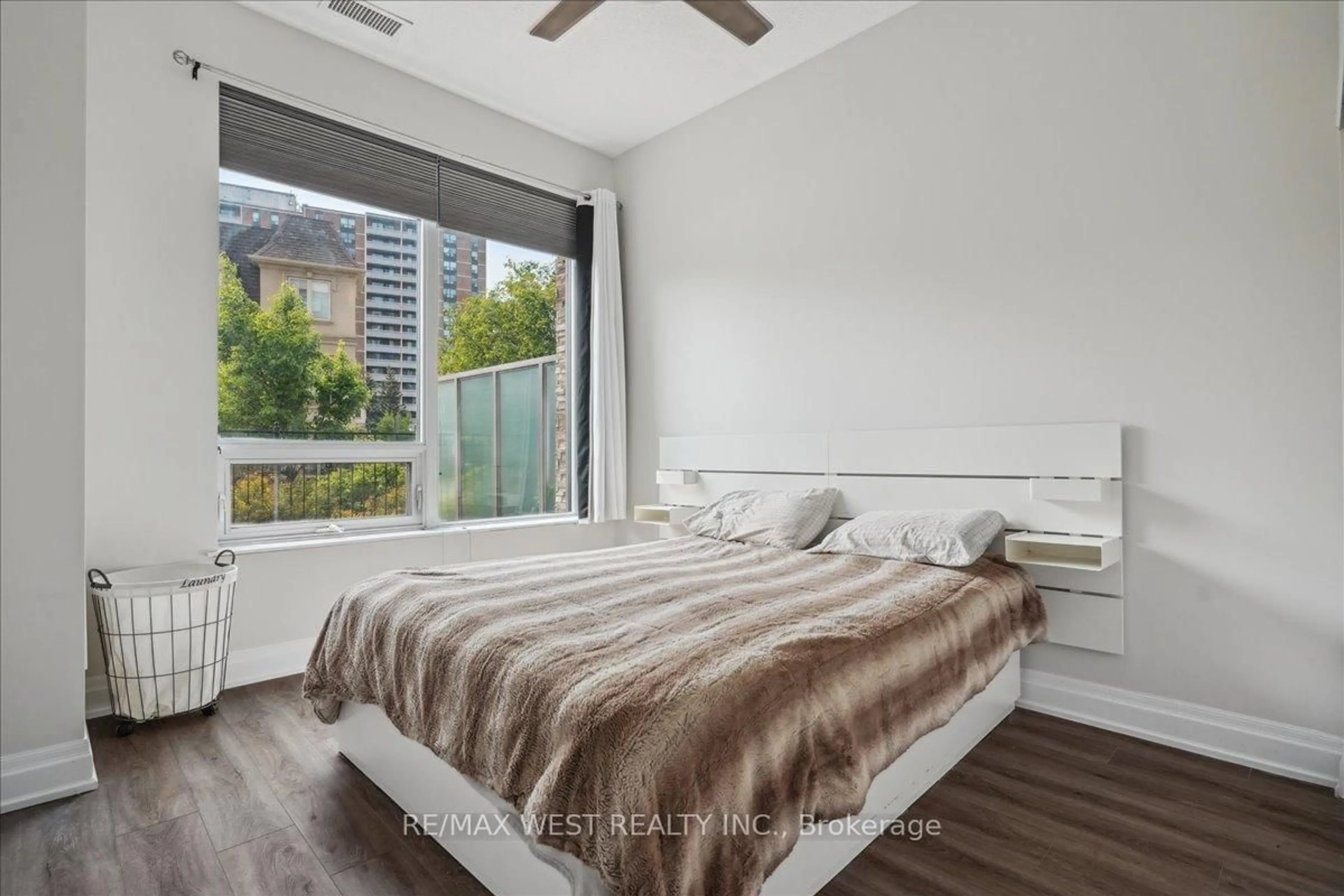 Bedroom with bed, wood/laminate floor for 1215 Bayly St #101, Pickering Ontario L1W 1L7