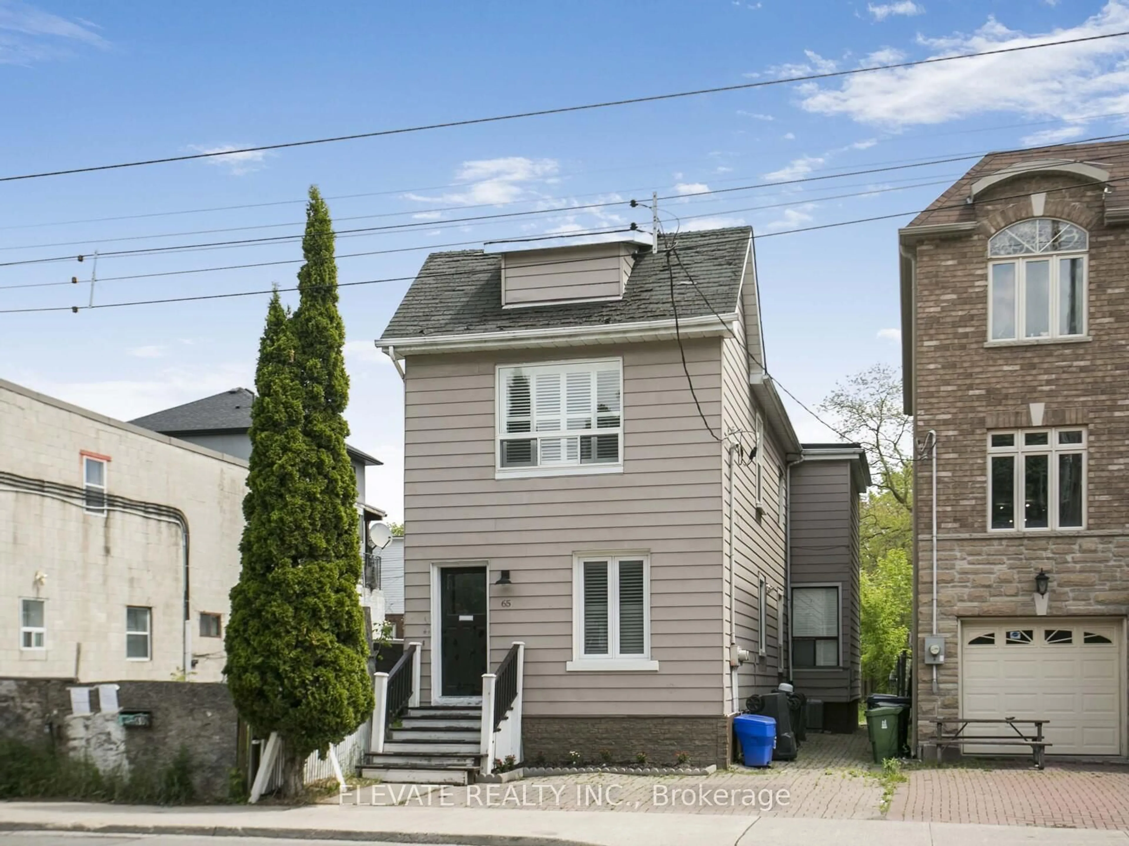 Home with vinyl exterior material, street for 65 Coxwell Ave, Toronto Ontario M4L 3B1