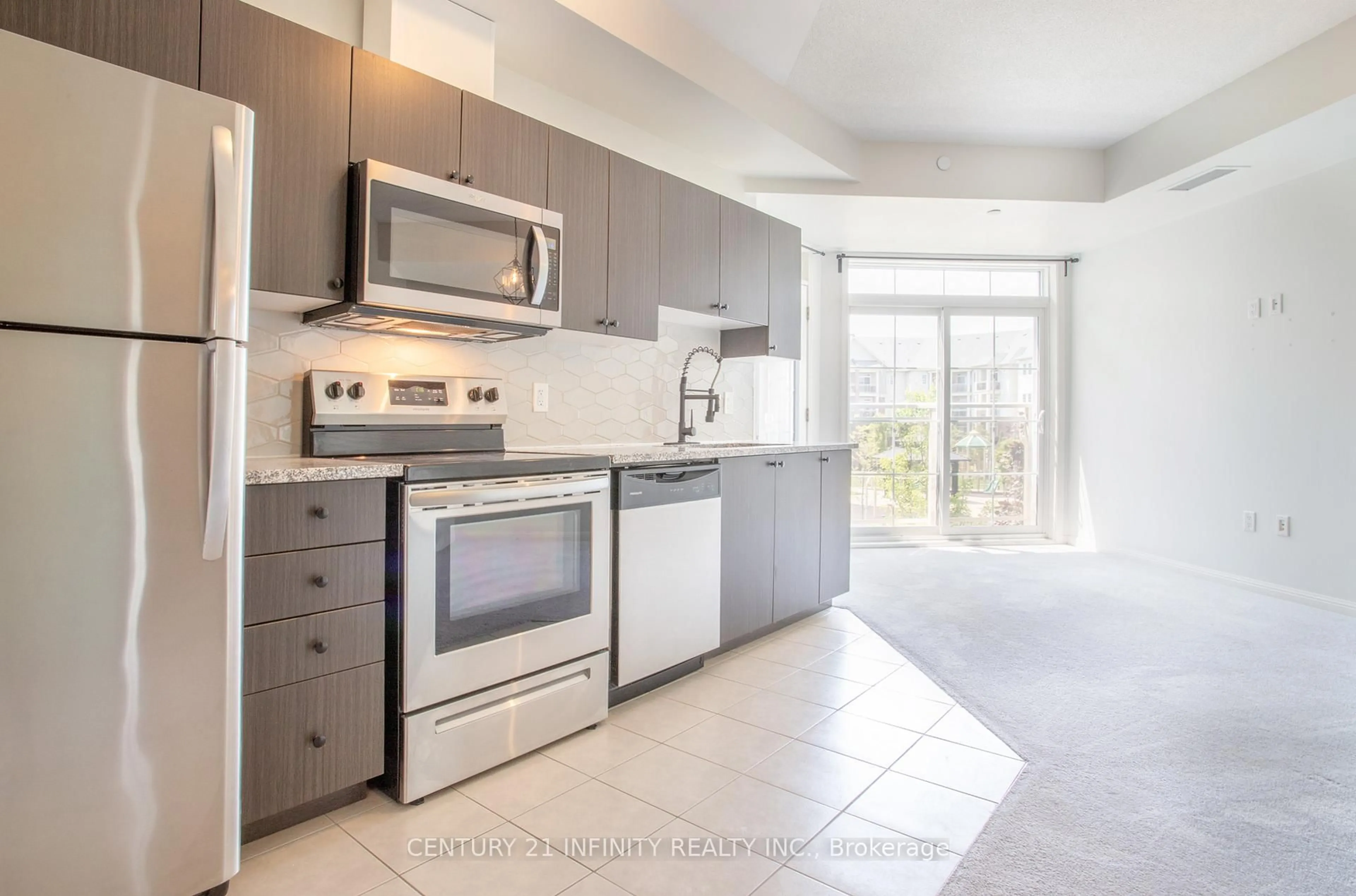 Open concept kitchen, ceramic/tile floor for 80 Aspen Springs Dr #201, Clarington Ontario L1C 0V4