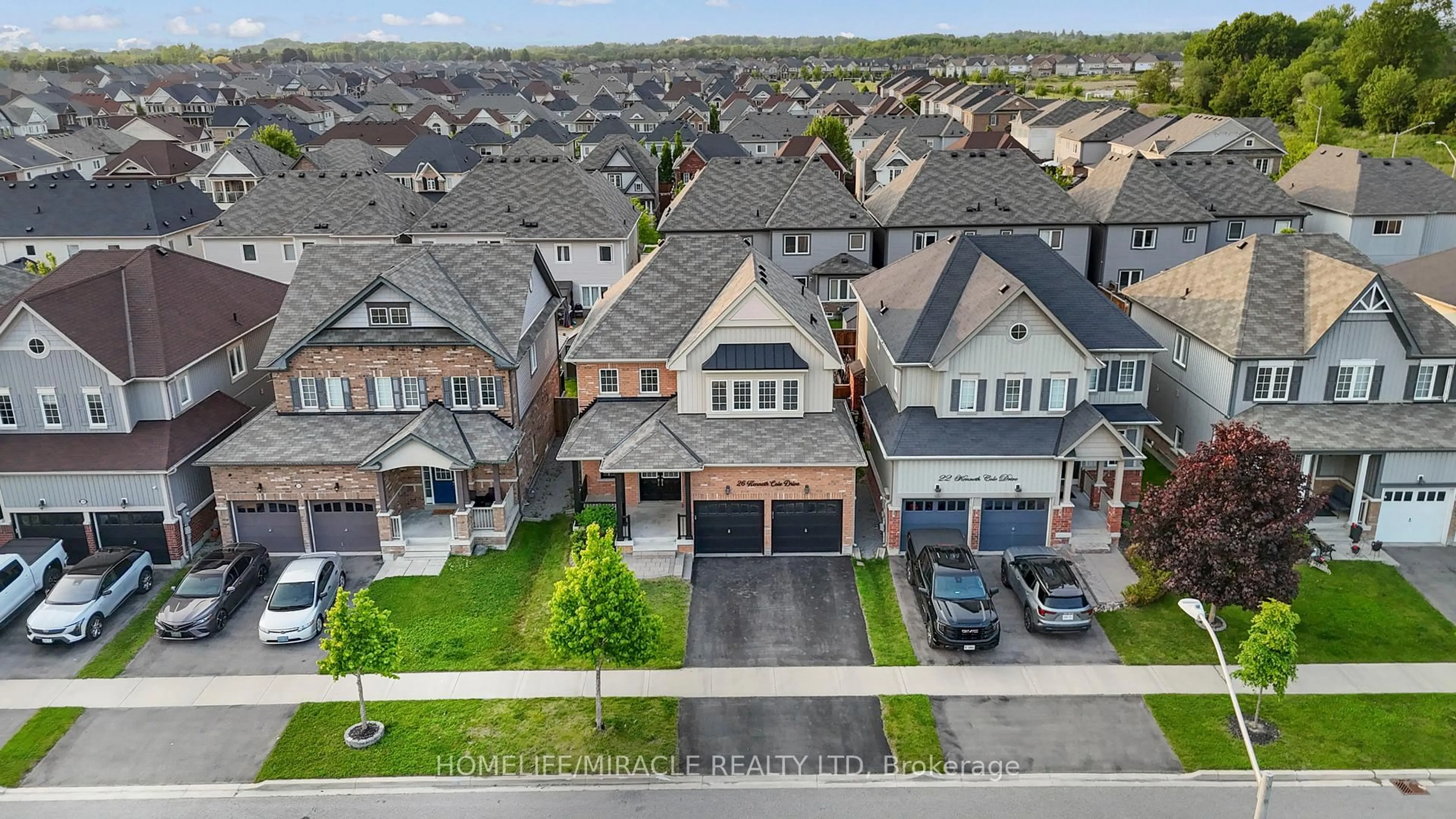 A pic from outside/outdoor area/front of a property/back of a property/a pic from drone, street for 26 Kenneth Cole Dr, Clarington Ontario L1C 0P3