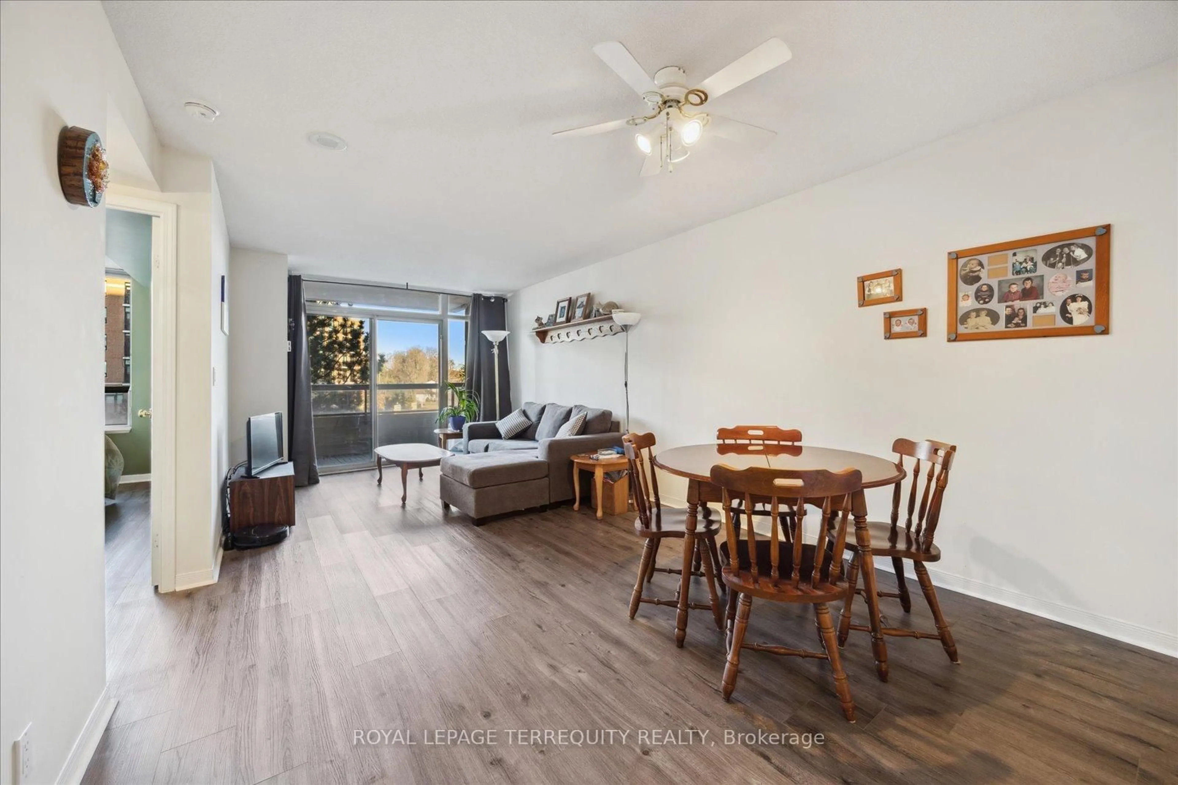 Living room with furniture, wood/laminate floor for 1000 The Esplanade #316, Pickering Ontario L1V 6V4