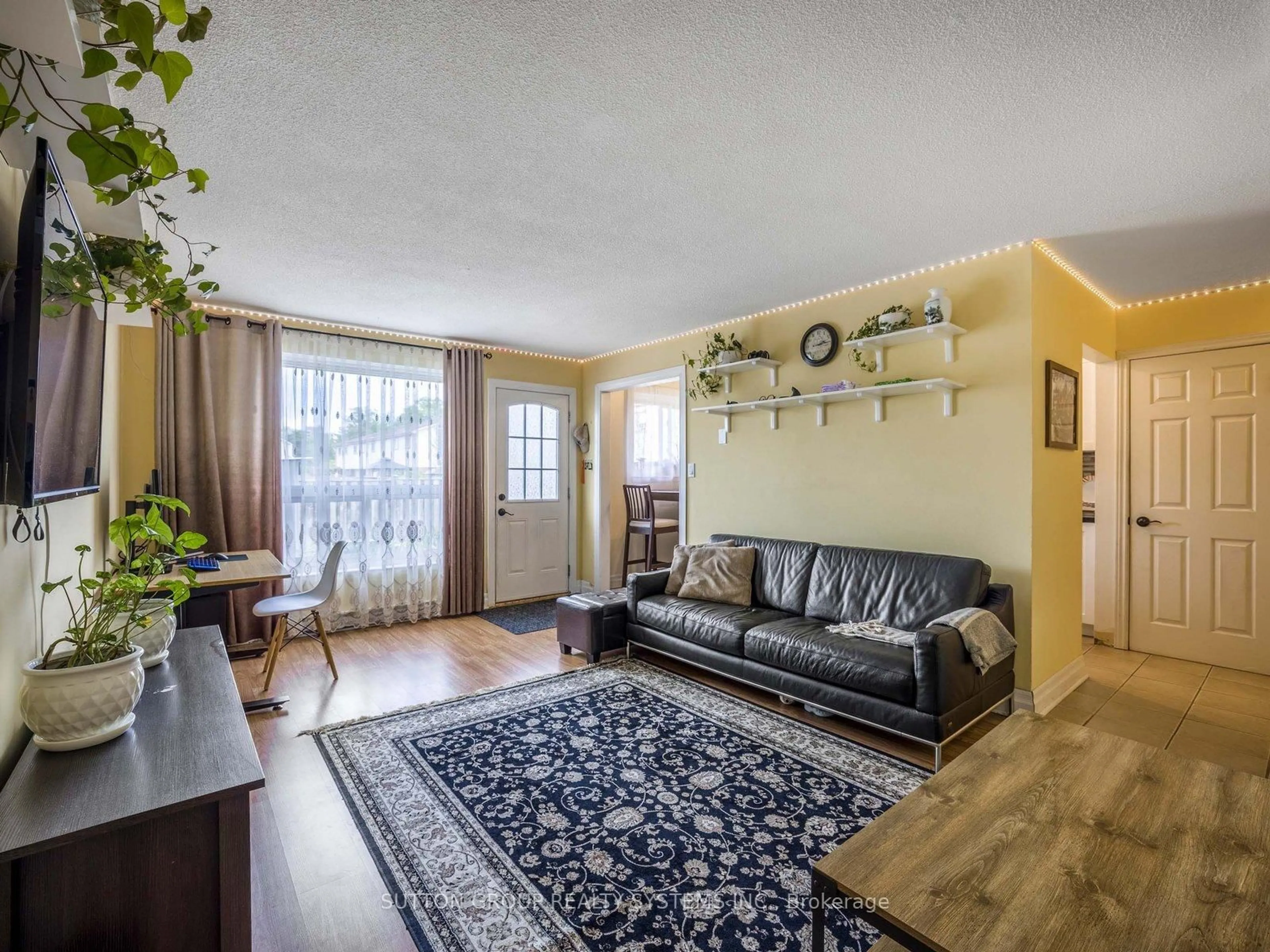 Living room with furniture, wood/laminate floor for 120 Nonquon Rd #55, Oshawa Ontario L1G 7E6